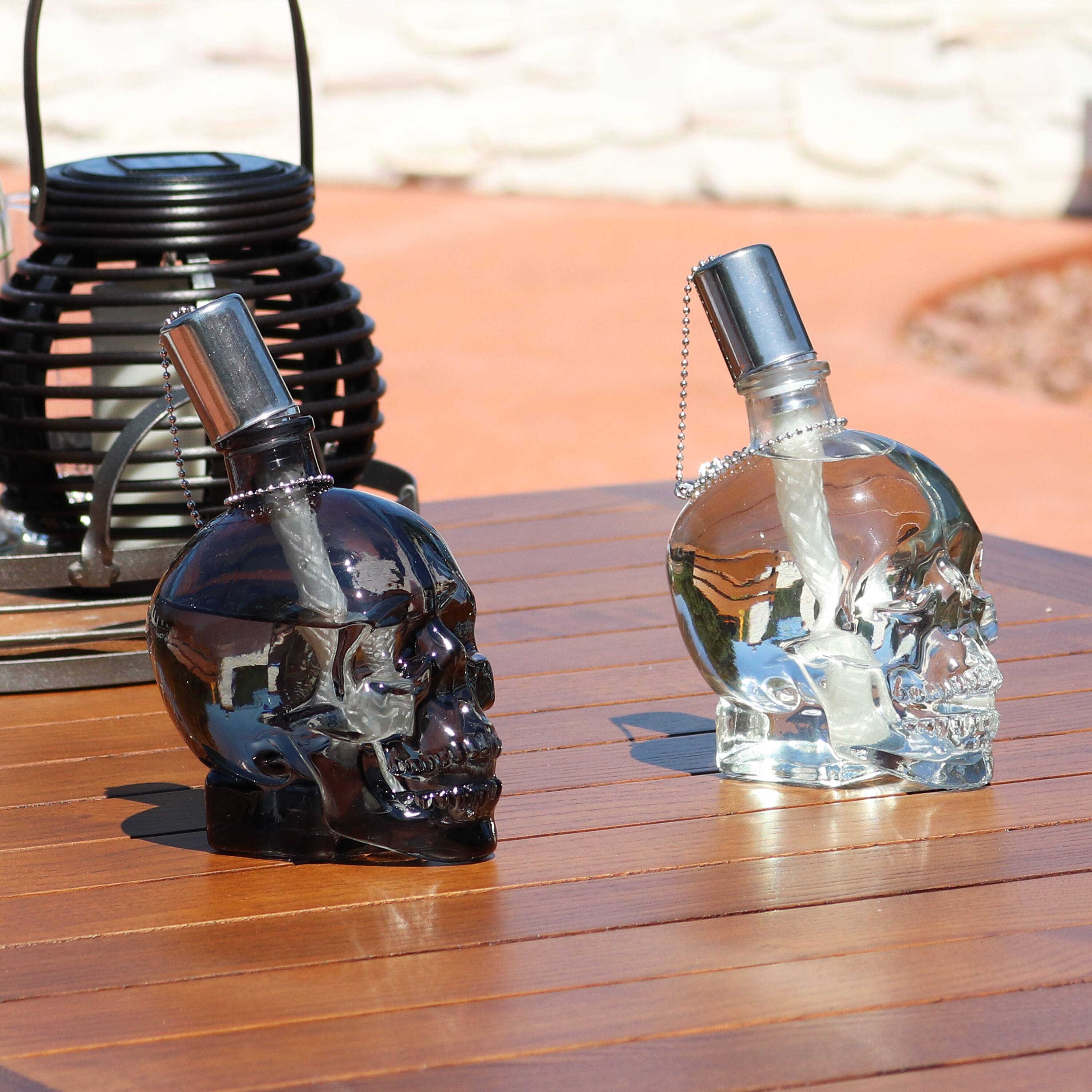 Alt View 3. Sunnydaze - Set of 4 Glass/Metal Grinning Skull Tabletop Torch - Black/Clear.