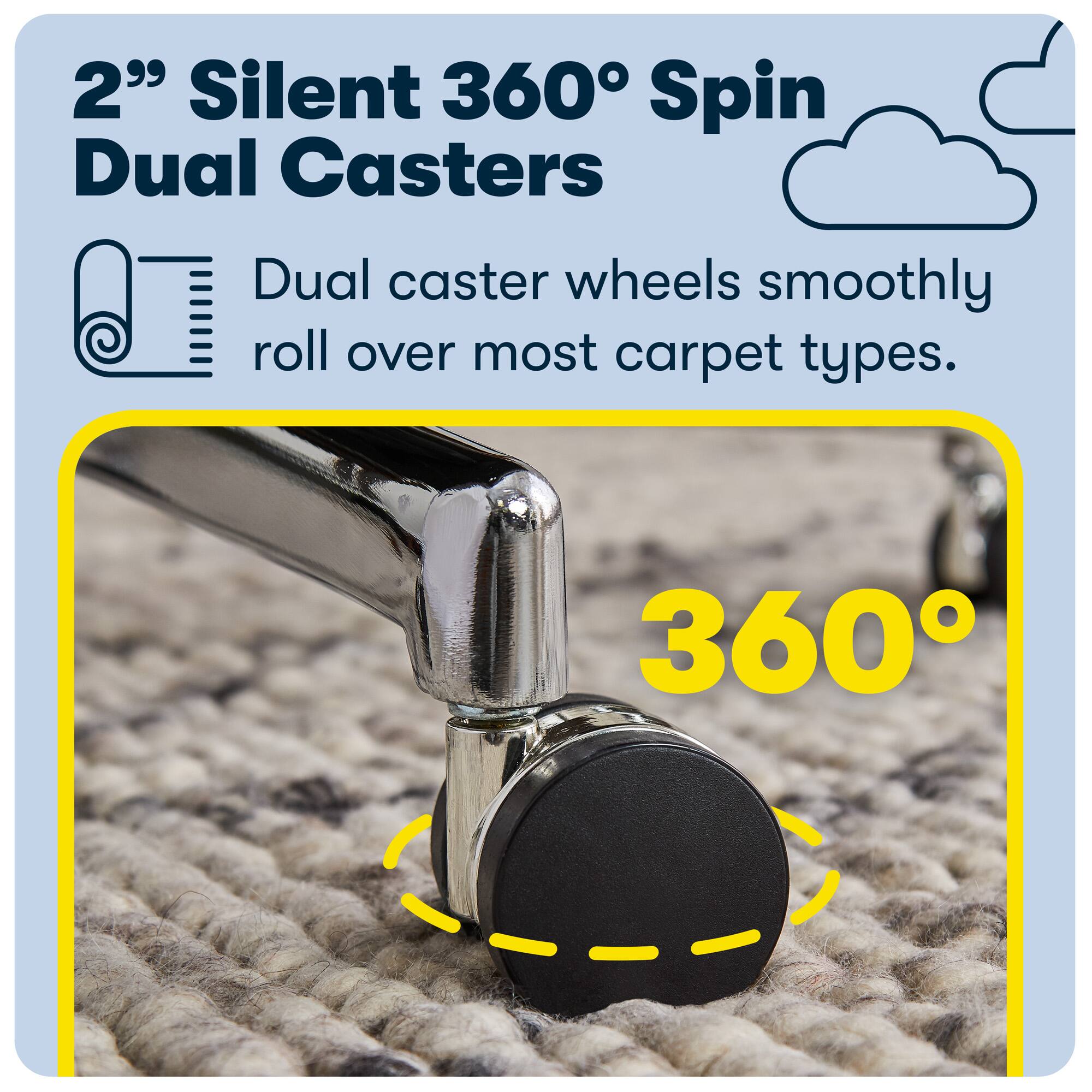 The image features a carpet cleaner with dual caster wheels, which are designed to smoothly roll over various carpet types. The carpet cleaner is equipped with 360-degree spin dual casters, making it easy to maneuver and maintain control while cleaning. The carpet cleaner is placed on a carpet, showcasing its functionality and effectiveness in cleaning the carpet.