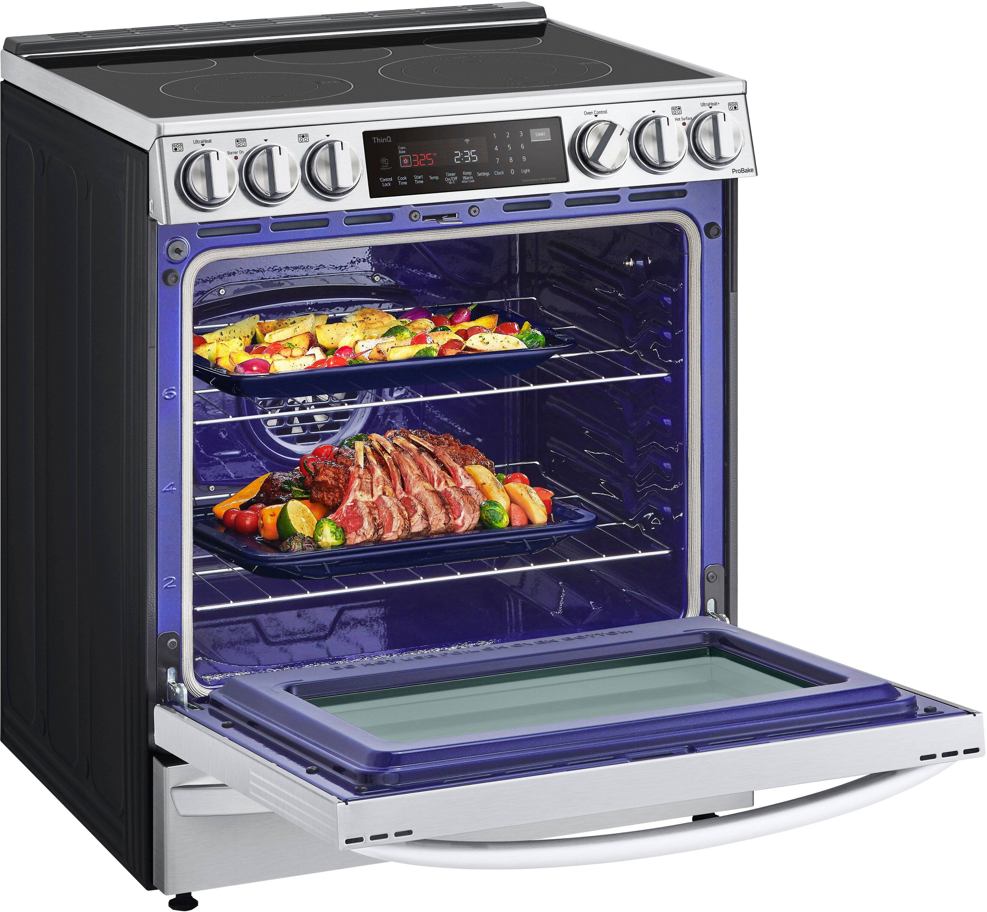 The image features a blue oven with a variety of food items inside. There are two trays of food, one containing meat and vegetables, and the other containing a casserole. The oven is set to 250 degrees, and the food is cooking for 2:35 hours. The oven is filled with a delicious assortment of dishes, making it an appealing sight for anyone who enjoys a well-prepared meal.