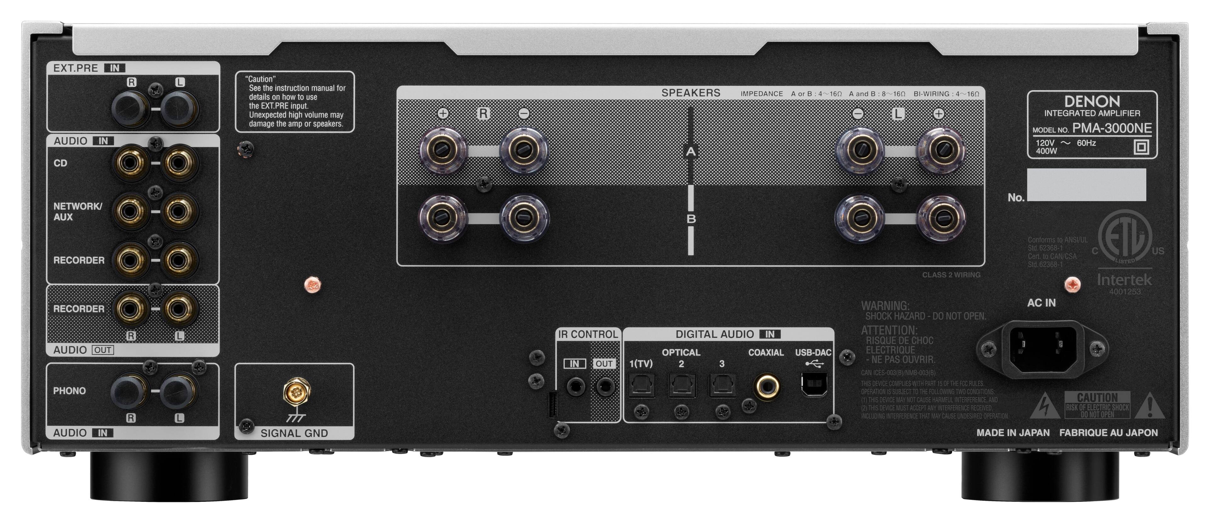 The image features a Denon integrated amplifier with various connections and settings. The amplifier has a total of 12 inputs, including a USB-DAC input, an optical input, and a coaxial input. There are also multiple speaker connections, including a subwoofer output. The amplifier is designed to handle a wide range of audio formats and is capable of delivering a powerful 400W of output. The device is made in Japan and is equipped with a warning label to caution users about the potential risks associated with electrical shocks.