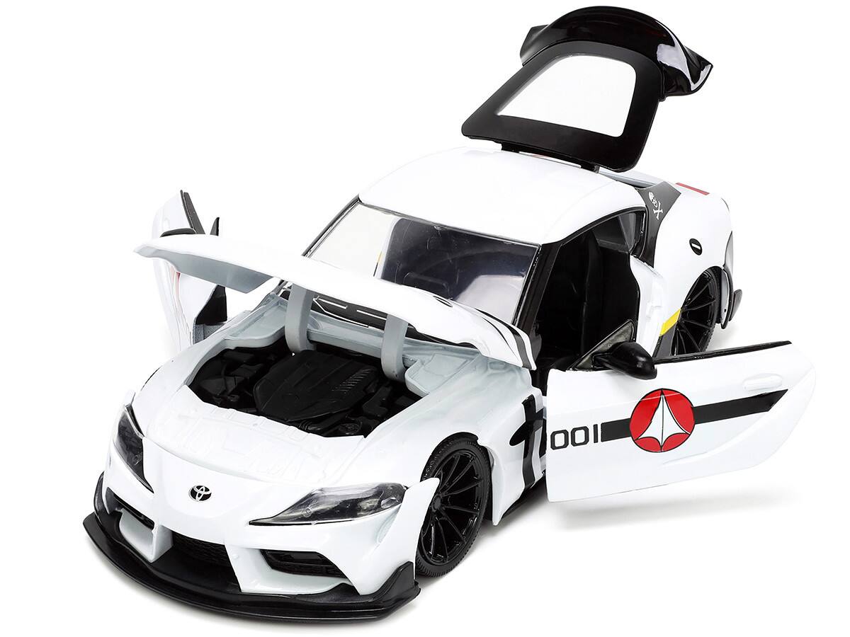 Angle. Jada - 2020 Toyota Supra White and Roy Focker Diecast Figurine "Robotech" "Hollywood Rides" Series 1/24 - White.