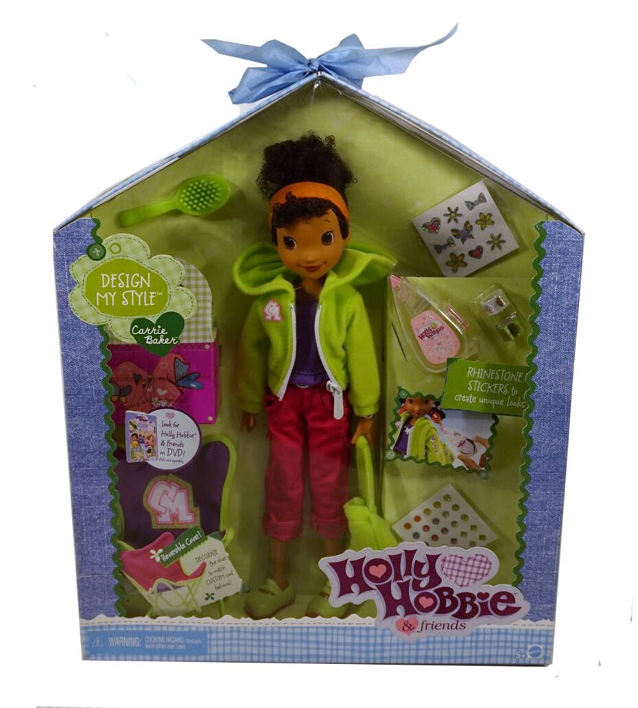 DESIGN MY STYLE  
Carrie Baker  

Holly Hobbie & friends  

RHINESTONE STICKERS to create unique looks  

Look for Holly Hobbie & friends on DVD!  

Removable Costume  

WARNING: CHOKING HAZARD - Small parts. Not for children under 3 years.