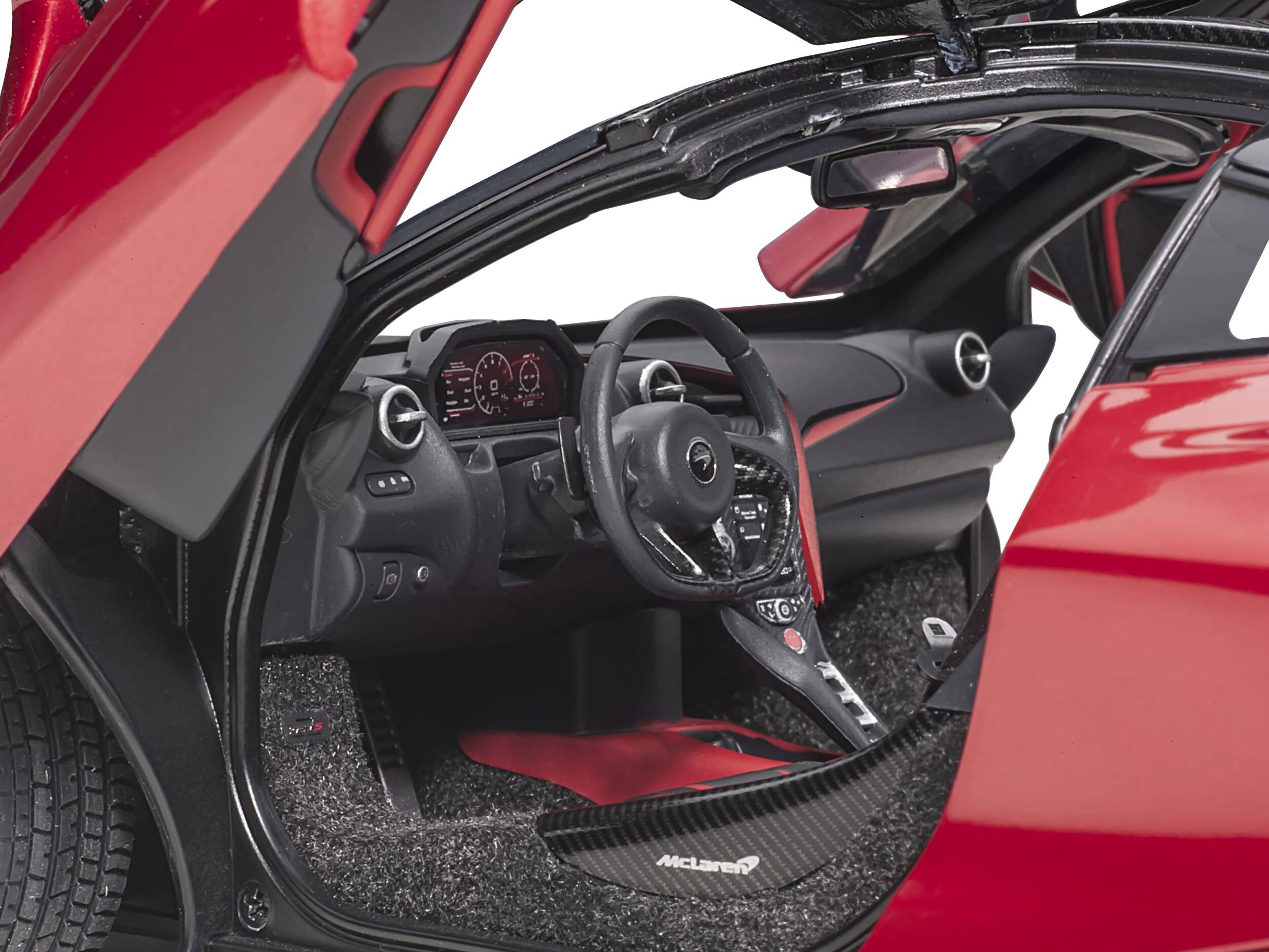 The text on the image reads:

- "McLaren" (on the floor mat)
- "720S" (on the side of the car's interior)