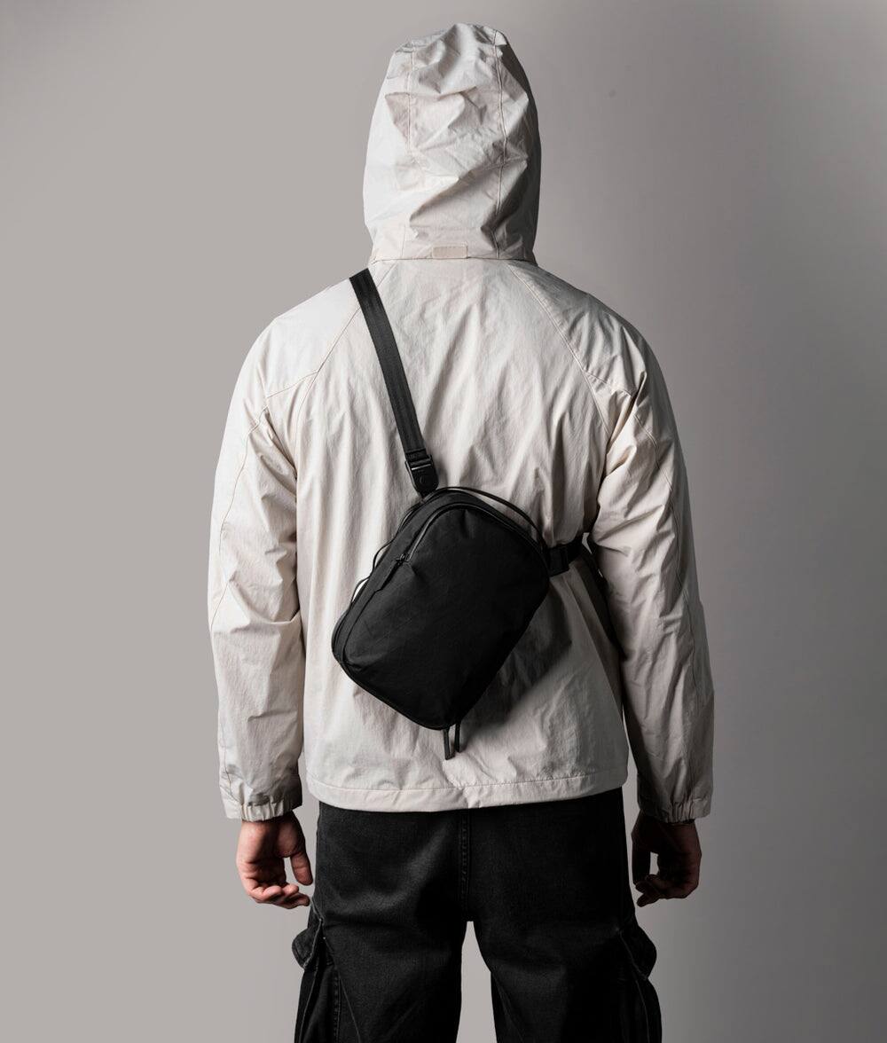 Angle. ALPAKA - Sling Bag for Men with 6 Inner Sleeves, Key Tether - Black X-Pac VX42.