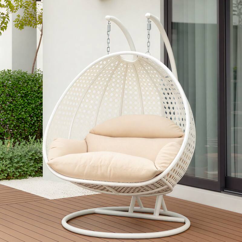 Left. LeisureMod - Leisuremod Modern 2-Person Outdoor Egg Swing White Wicker Chair with Stand, Plush Washable Cushions & Waterproof Cover - Beige.