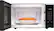 The image shows a microwave with a bowl of food inside. The microwave has a digital clock displaying the time of 12:20. The microwave has various auto functions, including potato reheat, cook, soften, and defrost. Additionally, there are manual options such as cook time, power level, steam clean, and quick start. The microwave also features a timer and a hole to set the timer. The image suggests that the microwave is ready to be used, and the user can choose from the available functions to cook or reheat their food.