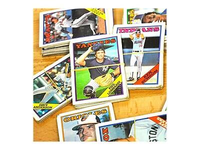 Sure, here is the corrected and grouped text from the image:

**Teams:**
- Braves
- Indians
- Yankees
- Orioles

**Players:**
- Phil Lombardi
- Dave Anderson
- Jack Schrom
- Tony

**Other Text:**
- "Superstar"
- "343" (possibly a jersey number or statistic)
- "XO" (partially visible on a card)