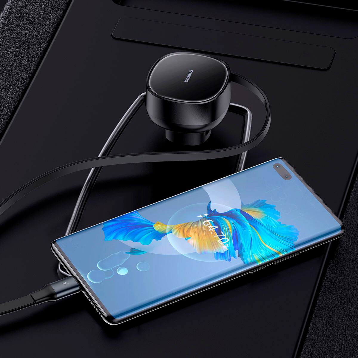 Bose is a company that produces audio equipment, such as speakers and headphones. The image shows a Bose speaker and headphones placed next to a cell phone.