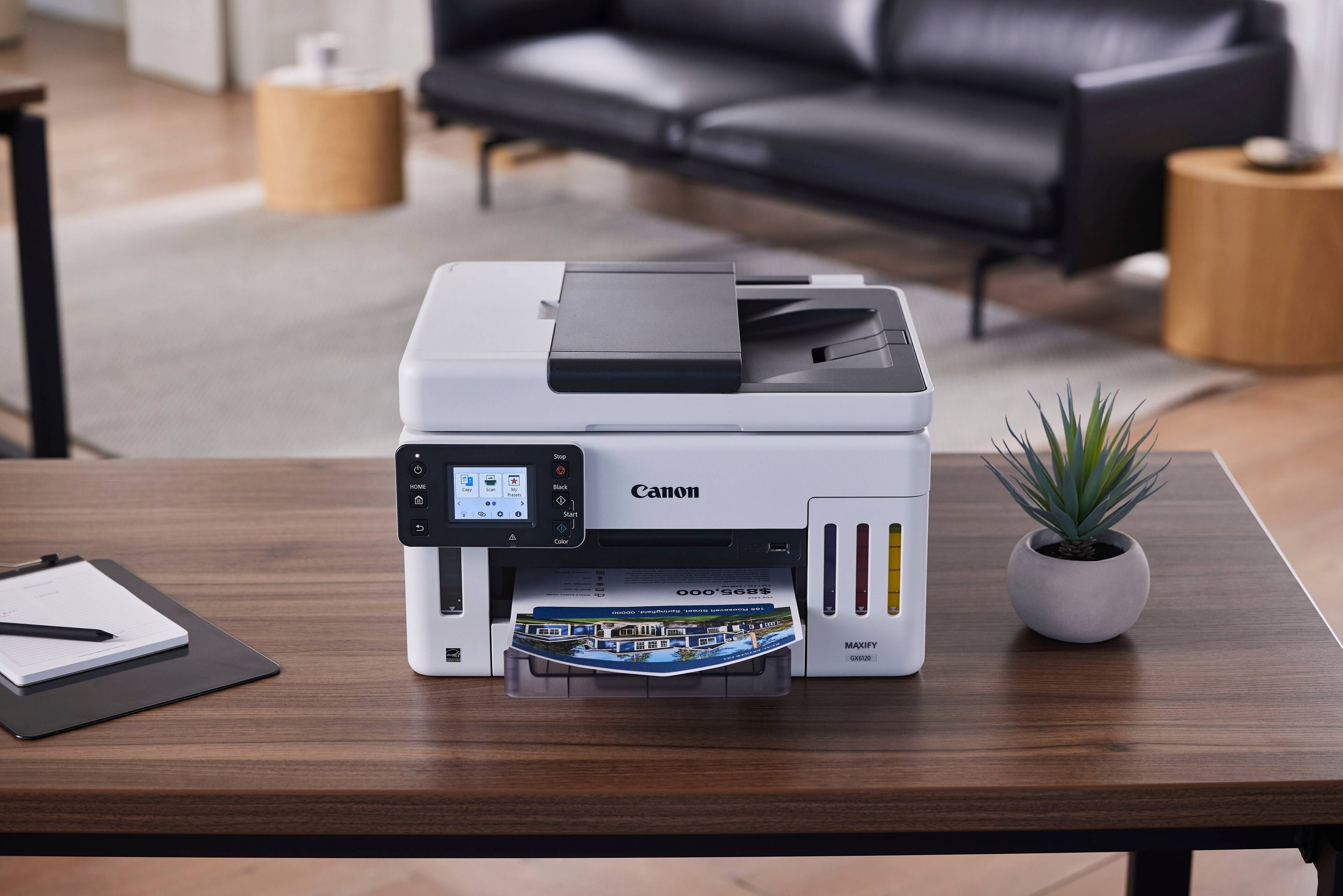Canon MAXIFY MB5600 printer on a wooden desk.