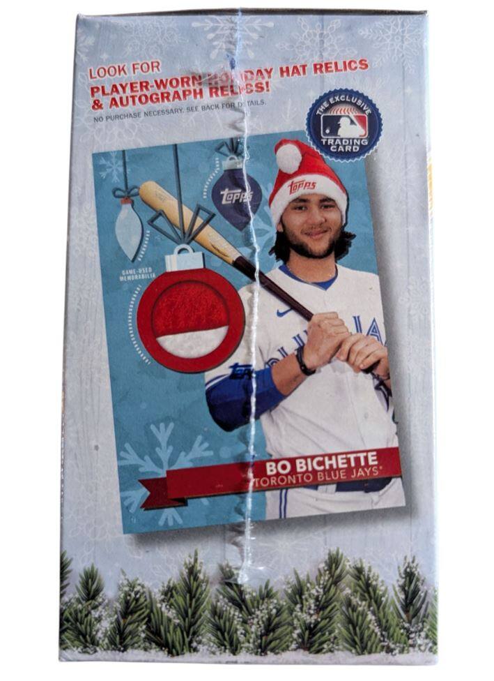 Sure, here is the corrected and grouped text from the image:

---

**LOOK FOR**  
PLAYER-WORN HOLIDAY HAT RELICS & AUTOGRAPH RELICS!  
NO PURCHASE NECESSARY. SEE BACK FOR DETAILS.

**THE EXCLUSIVE**  
TRADING CARD  
TPS GANE-US1D MEMORABILIA II

**BO BICHETTE**  
TORONTO BLUE JAYS

---

This text is from a trading card package featuring Bo Bichette of the Toronto Blue Jays.