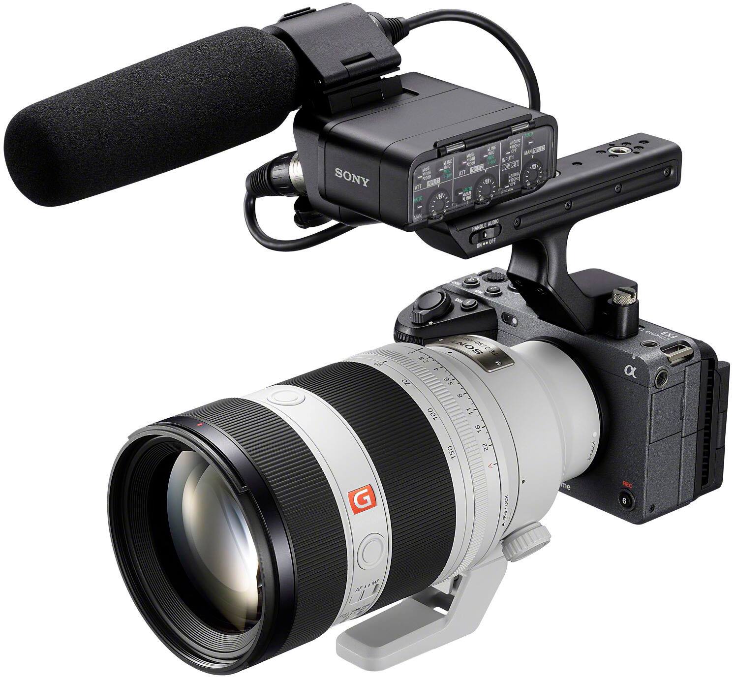The image features a Sony camera with a large lens attached to it, along with a microphone. The camera is set up to record video, and the microphone is positioned to capture audio. The camera and microphone are connected to a laptop, which is likely being used to control the recording process. The setup is ideal for capturing high-quality video and audio content, such as interviews, documentaries, or live events.