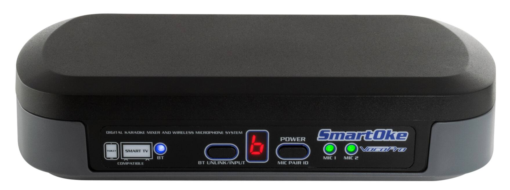 The text on the image reads: "SMART TV BT COMPATIBLE BT UNLINK/INPUT POWER SmartOke VocOHro MIC I MIC 2 MIC PAIR I0." This text describes a digital karaoke mixer and wireless microphone system that is compatible with smart TVs and has a Bluetooth unlink/input power feature. The system includes a SmartOke VocOHro MIC I and MIC 2, as well as a MIC PAIR I0.