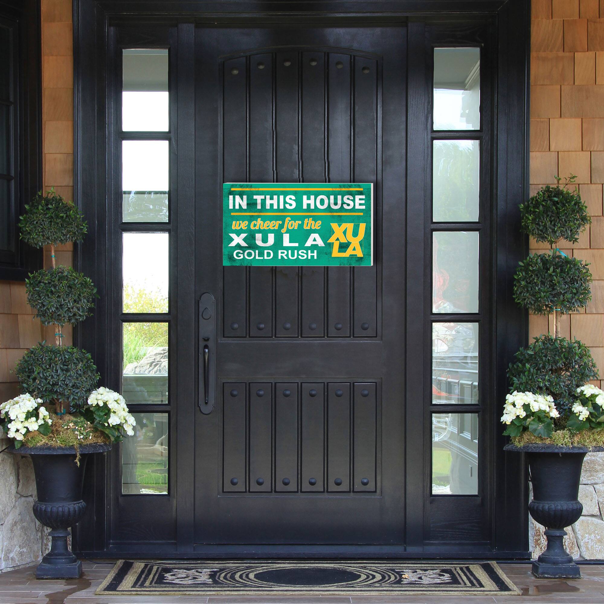 IN THIS HOUSE  
we cheer for the  
XULA XU  
GOLD RUSH