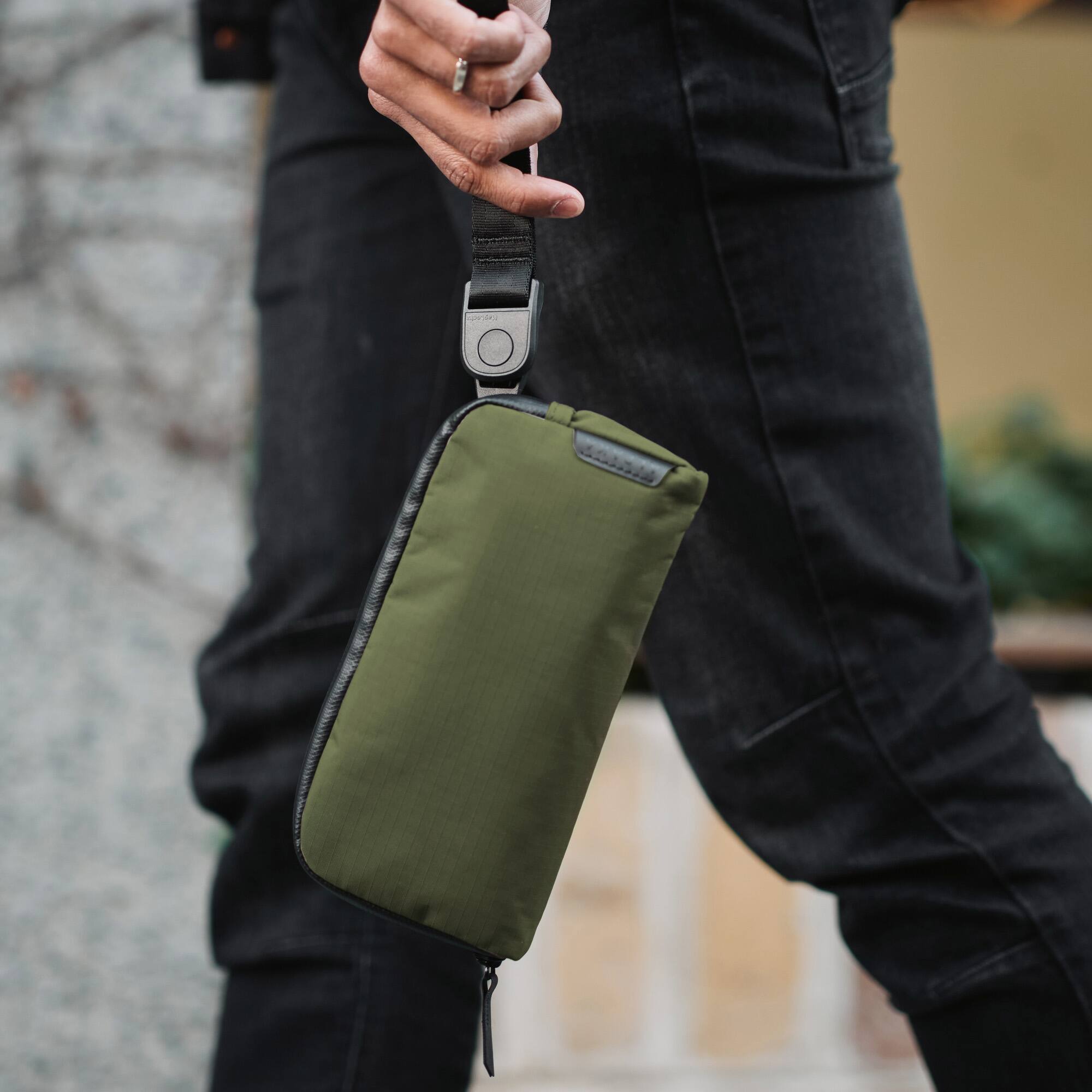 Angle. ALPAKA - Flight Pouch Crossbody Phone Bag & Travel Organizer for Passport, Phone, Cards & Everyday Carry, Weather-Resistant - Green Axoflux 210D.
