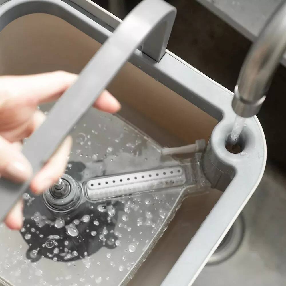 Left. OU - OU Spin Mop with Clean Dirty Water Separation Bucket, 360° Rotating Mop Bucket with Extra Refill.