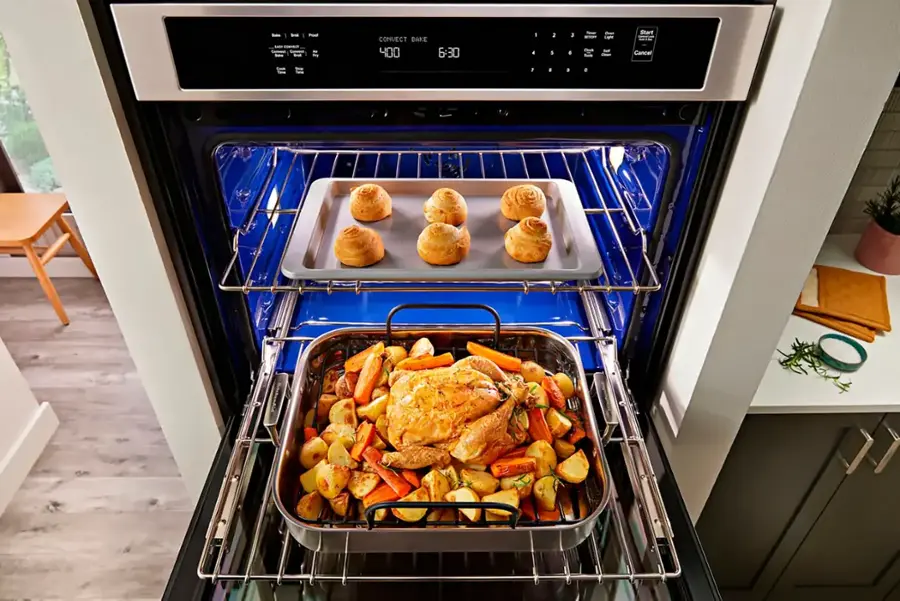 The text on the image reads: "CORVEET CONVECT BAKE 400 6:30 1 a 2 1 . e - - Chud - Can L -ar Start Cancel 1 a a." This text appears to be a recipe or cooking instructions for a dish being prepared in the oven. It suggests that the dish should be cooked at 400 degrees Fahrenheit for 6:30 minutes, using a convect bake setting. The recipe also includes a list of ingredients, such as carrots, which are visible in the image.