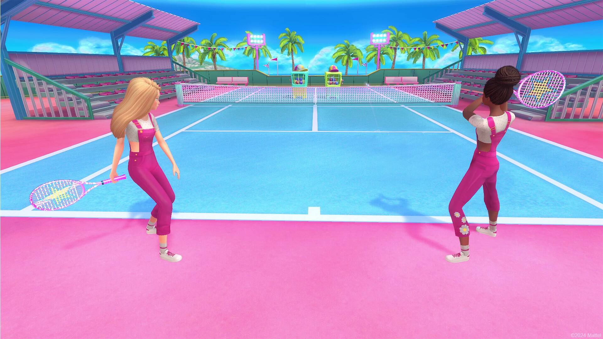 Two women playing tennis on a pink court.