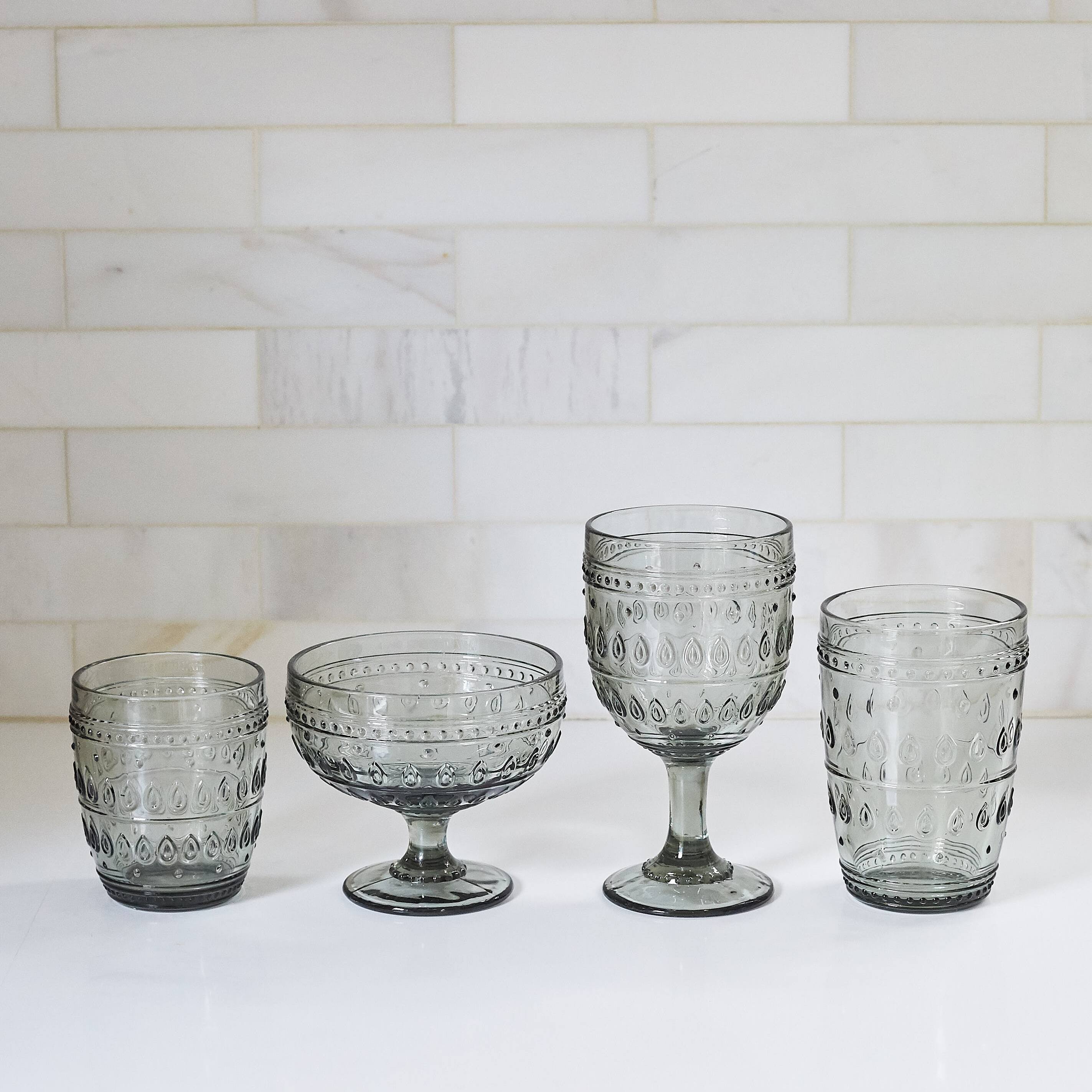 Left. Euro Ceramica Home - Fez Glassware 4 Piece 13oz Footed Compote Glass Set in Grey - Clear.