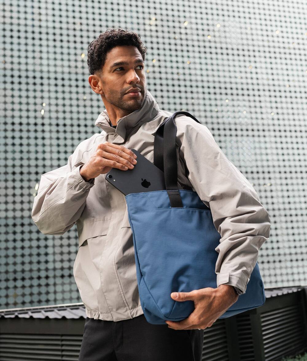 Left. ALPAKA - Elements Tote Bag 14.5L Weatherproof Foldable Travel Tote with Magnetic Closure - Blue/G Axoflux 210D.