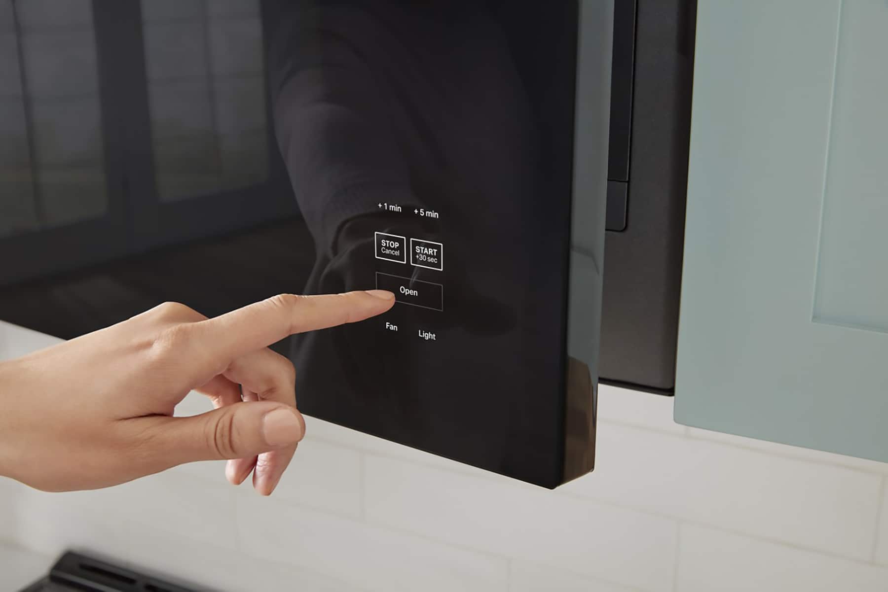 The text on the image reads "1 min" and "5 min" as options for the timer. The person is pointing at the "1 min" option, indicating that they want to set the timer for one minute.