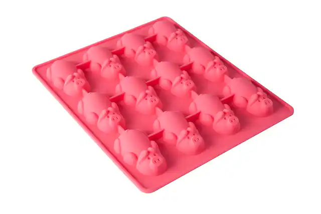 Front. MOBI - 12 Pigs in a Blanket Silicone Snack Mold, Little Pigs in Blankets - Pink.