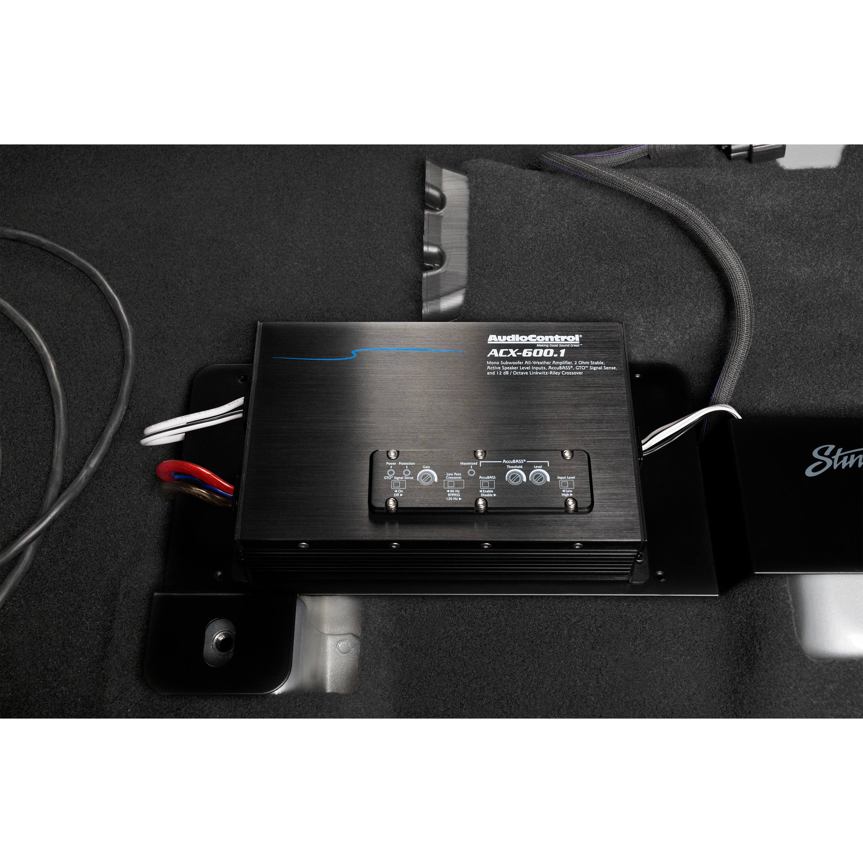 AudioControl ACX-600.1 is an electronic device that is placed on a black surface.