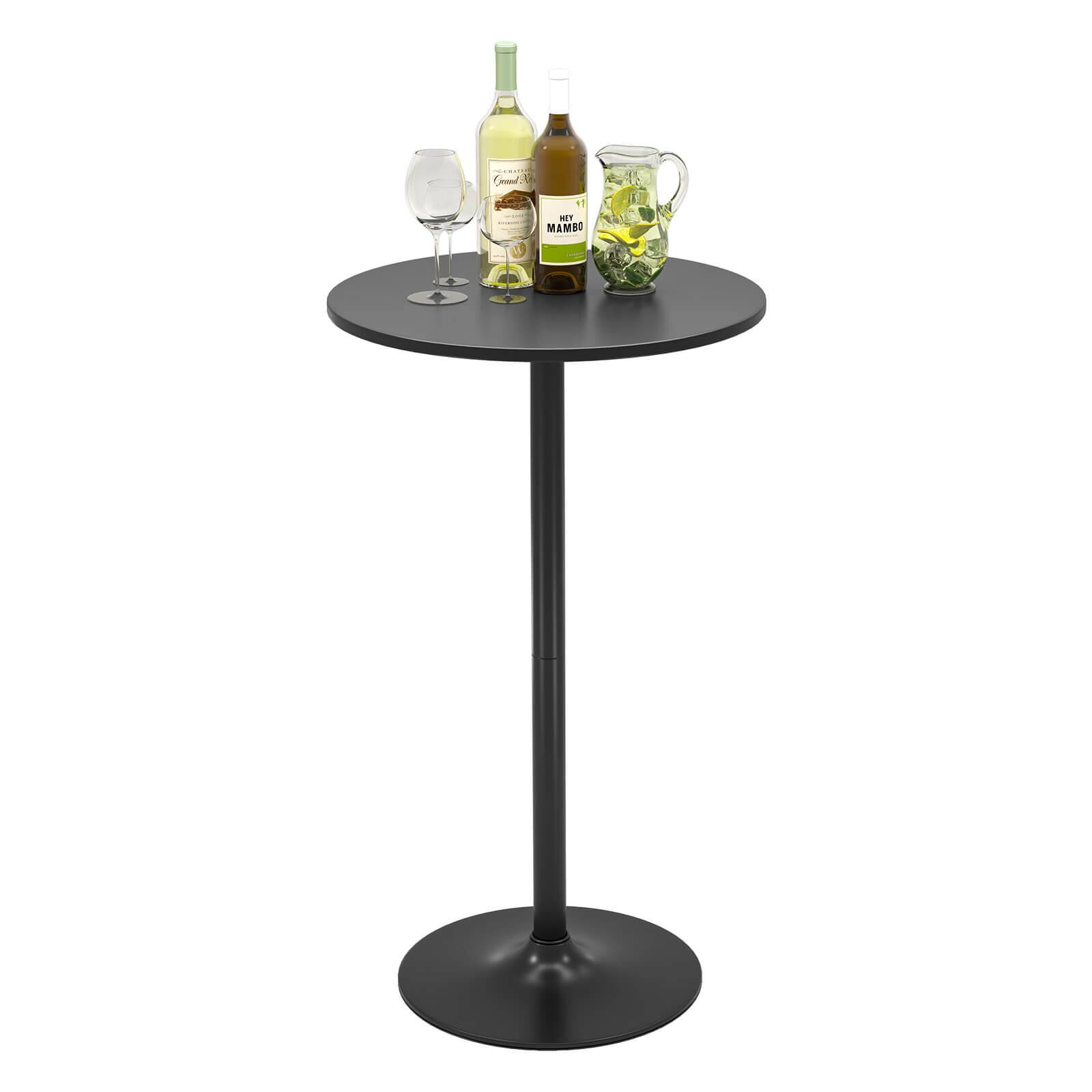 A black table with a glass of wine and two bottles of wine on it.