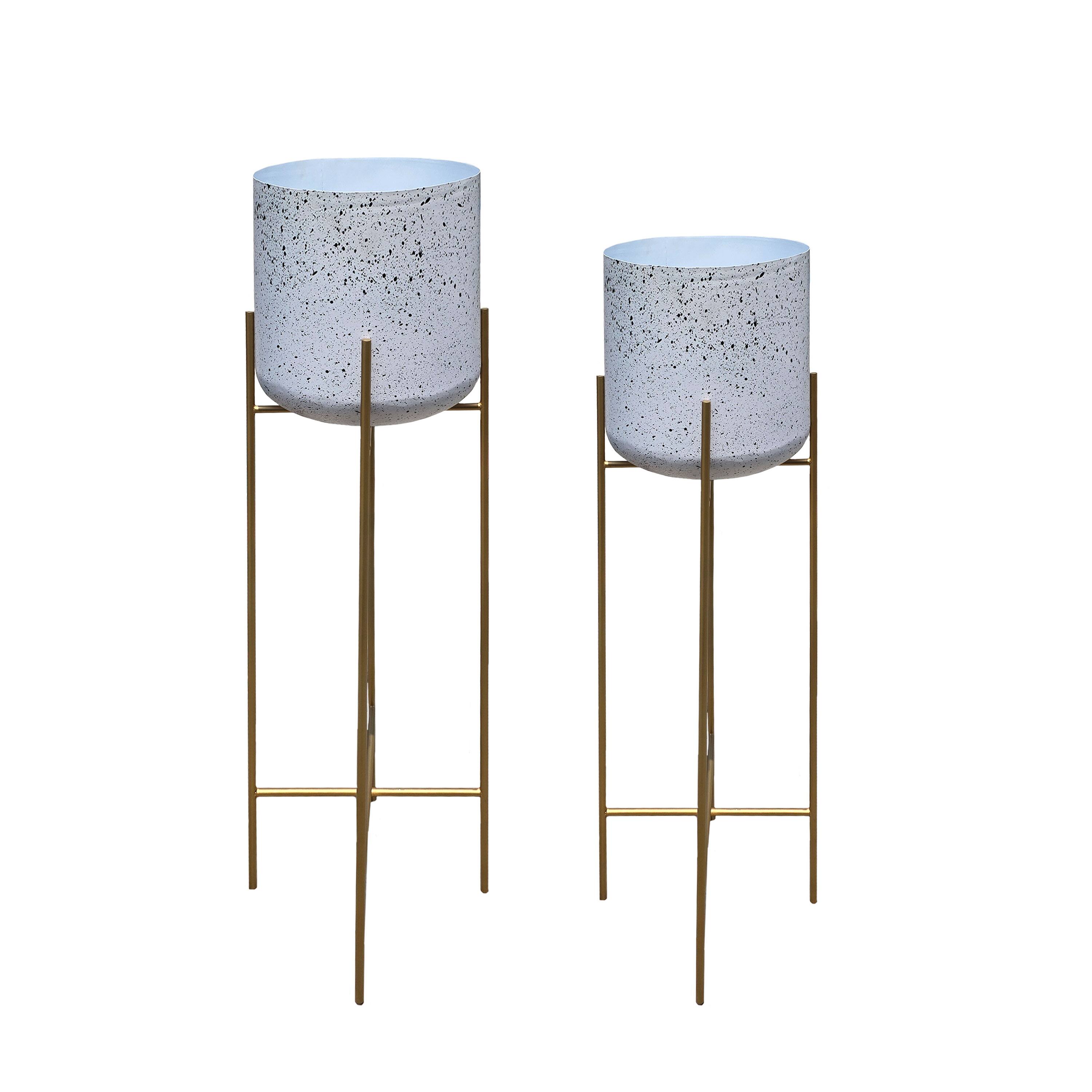 Front. Manhattan Lane - Aira 39, 46" Tall Planters Set of 2 | Gold Foldable Metal Stand | White Speckled Pattern.
