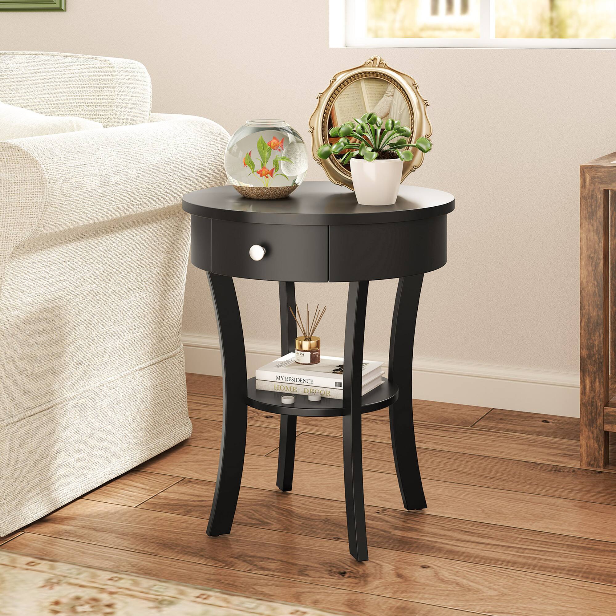 My home decor includes a small table with a glass bowl, a mirror, and a plant. The table is black and has a glass top. The glass bowl on the table contains a flower, adding a touch of color and life to the space. The mirror and plant also contribute to the overall aesthetic of the room, creating a cozy and inviting atmosphere.