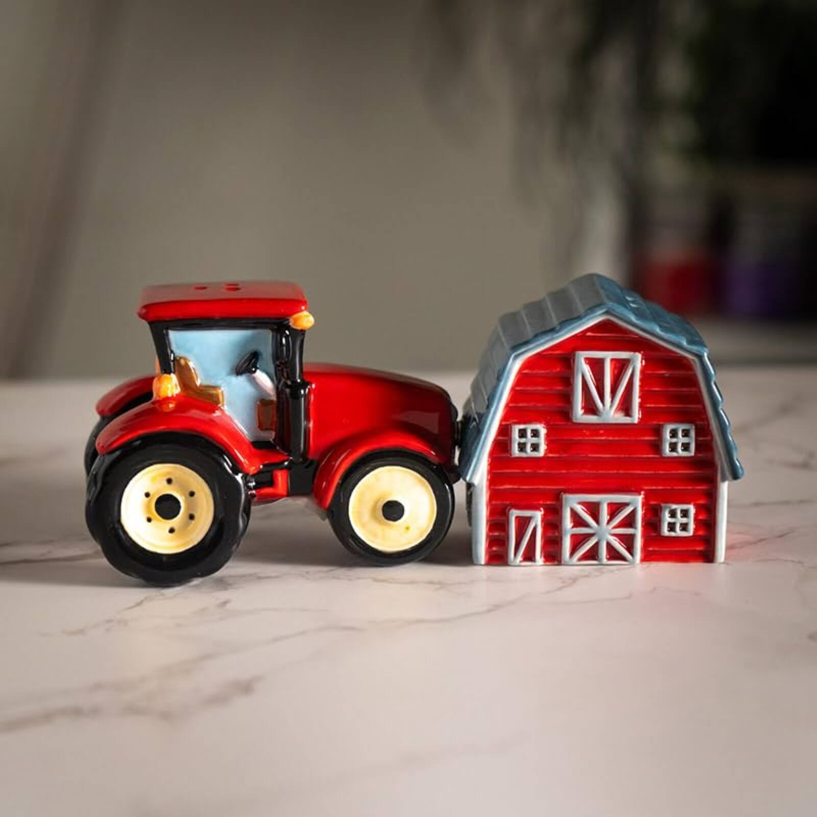 Left. Pacific Trading - Red Tractor and Barn Country Kitchen Ceramic Magnetic Salt and Pepper Shaker Set - Red.