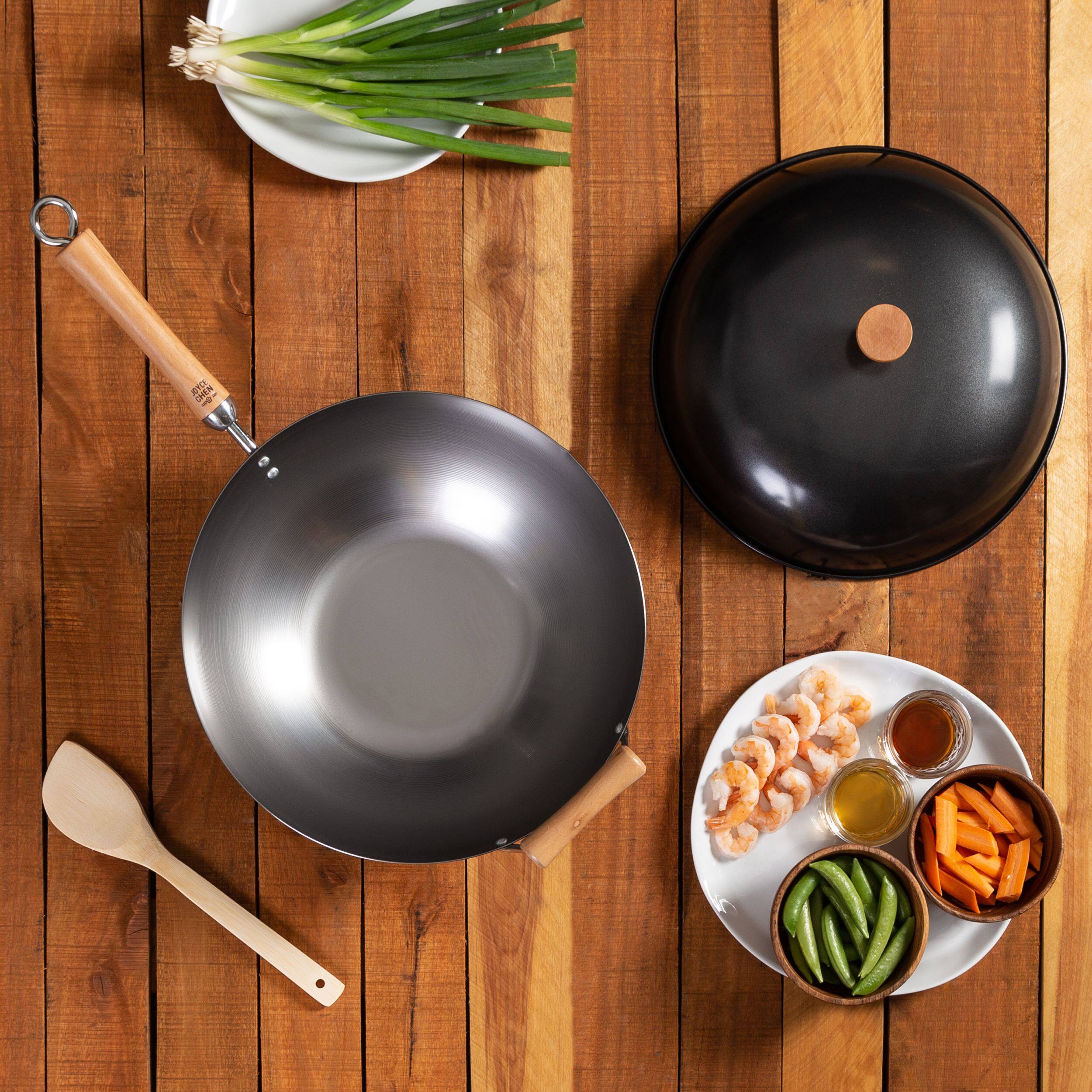 Angle. Joyce Chen - Classic Series 14-Inch Uncoated Carbon Steel Flat Bottom Wok Set with Lid and Birch Handles, 4 Pieces - Silver.