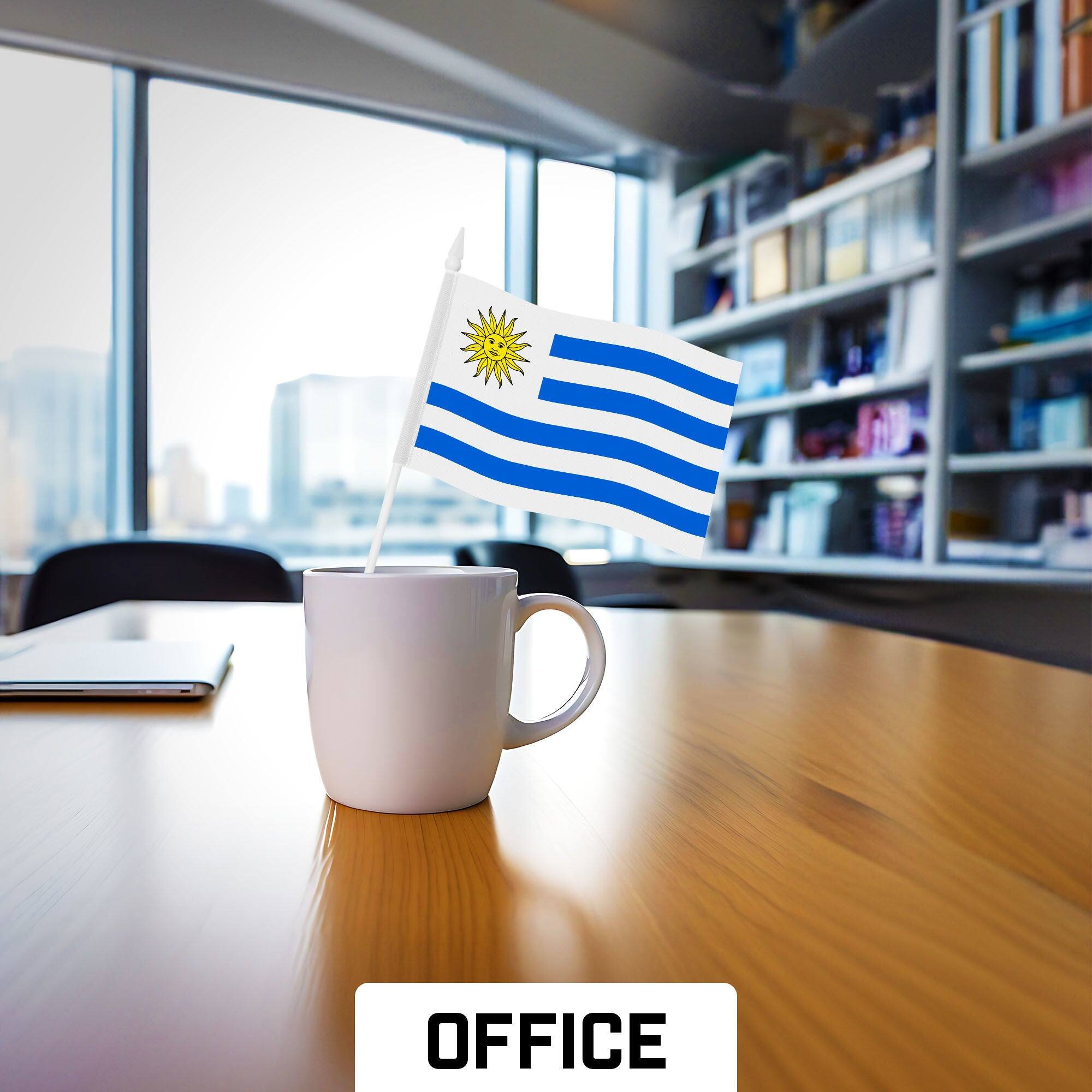 Left. G128 - 24-Pack Handheld Uruguay Stick Flags - 4 x 6 in Printed 150D Polyester, Plastic Stick with Spear Tip. - Assorted Colors.