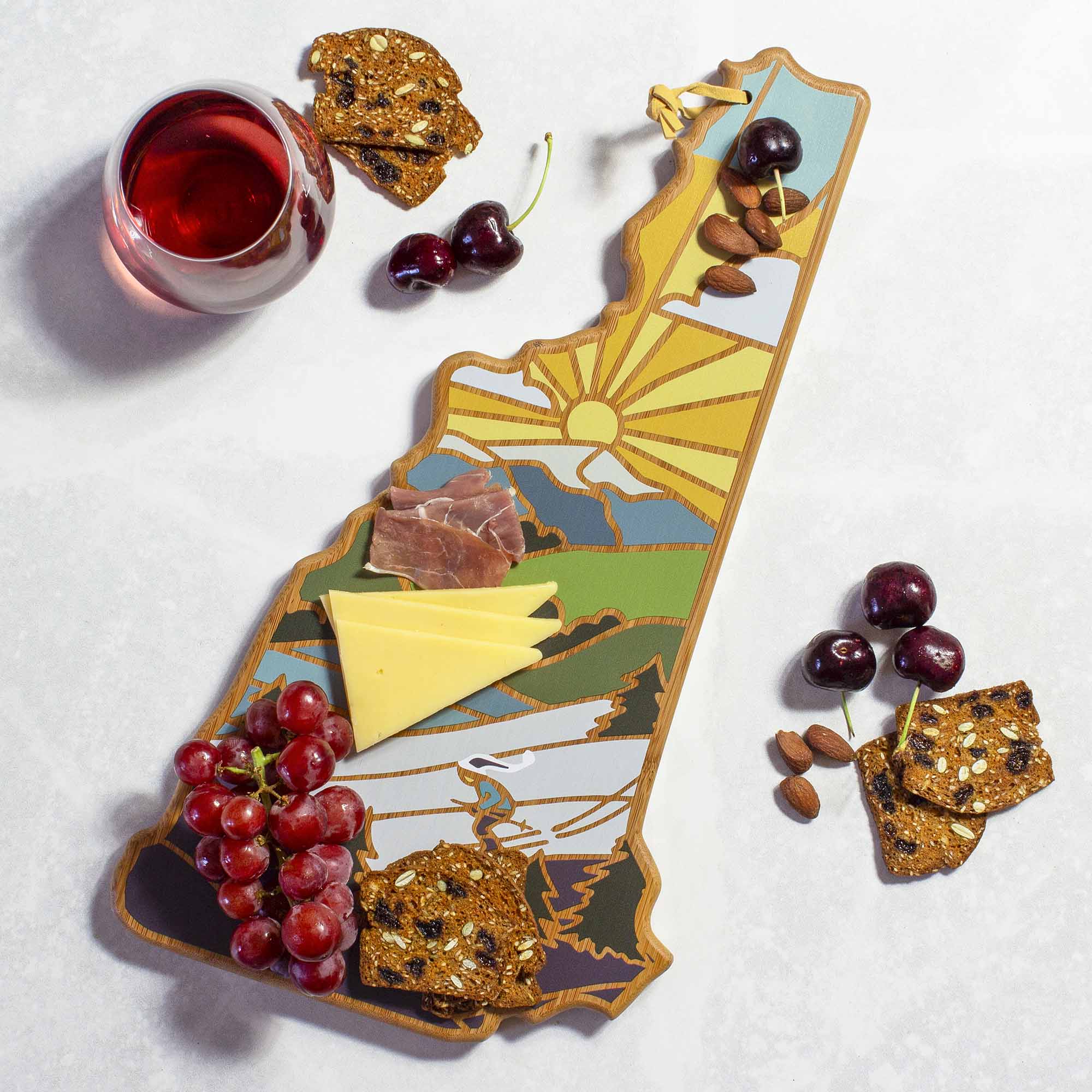 Angle. Totally Bamboo - New Hampshire Cutting Board with Artwork by Summer Stokes.