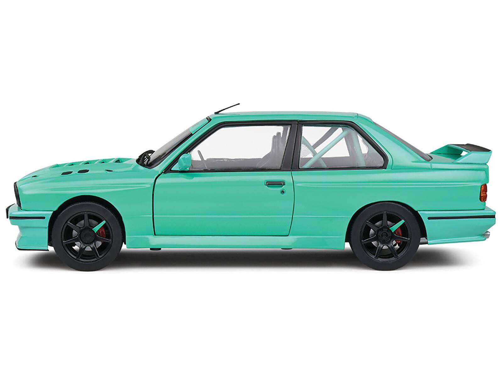 Left. Solido - 1990 BMW E30 M3 Custom "Drift Missile" Tiffany Blue 1/18 Diecast Model Car by Solido - Blue.