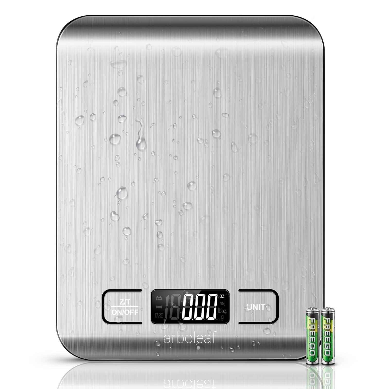 The image features a silver scale with a digital display showing the weight of 18.08 pounds. Next to the scale, there are two small batteries, one of which is a 9V battery. The batteries are placed on the scale, possibly for weighing purposes.