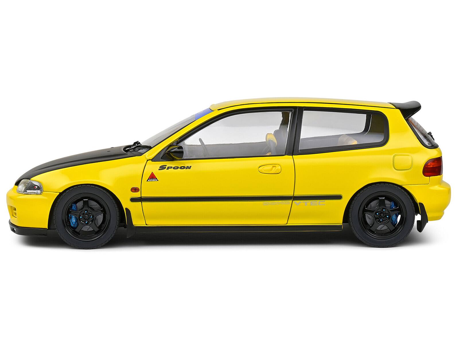 The text on the image reads:

- "SPOON"
- "VTEC"
- "GD0-002"