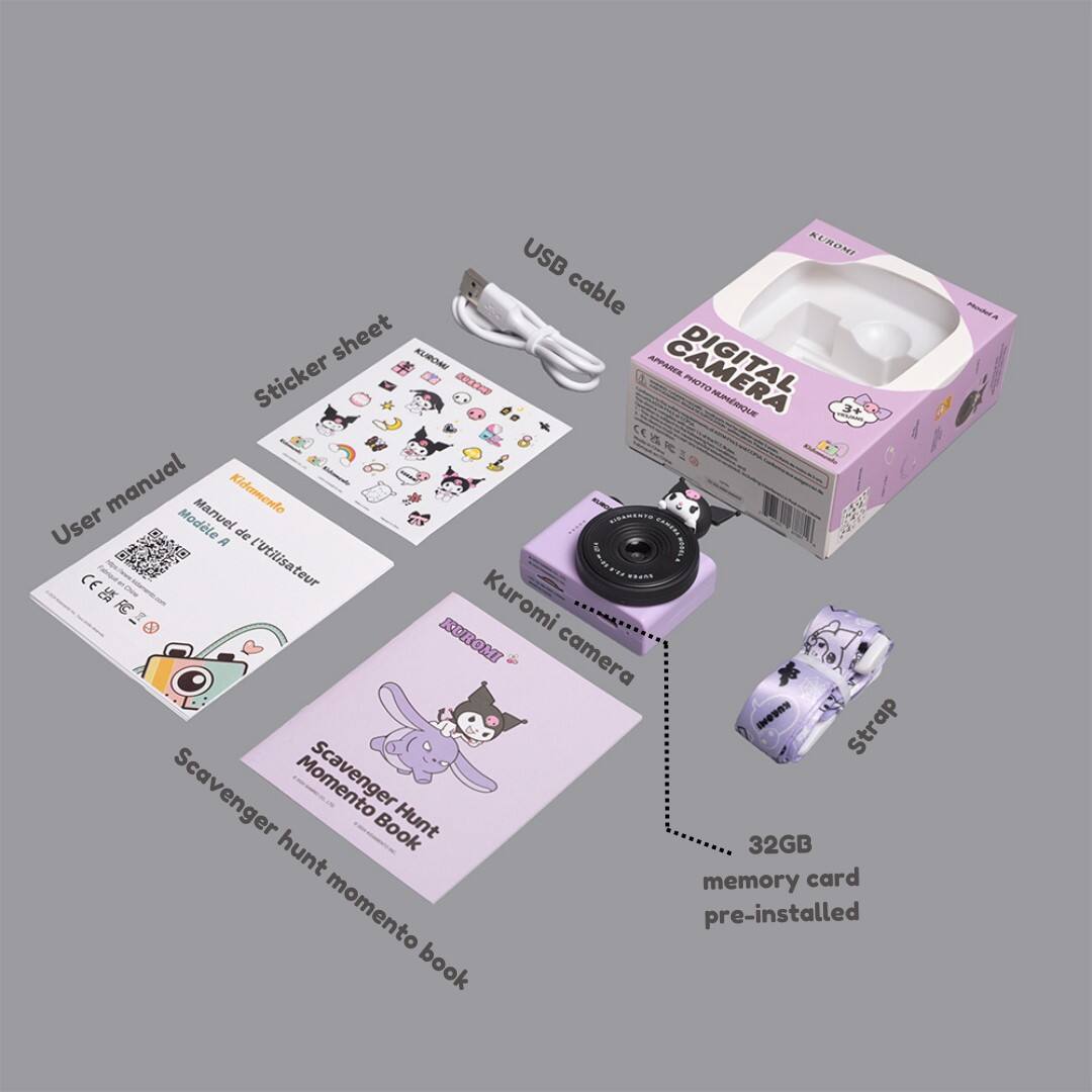 The image features a digital camera with a cat design, along with a strap and a memory card. The camera is accompanied by a box that contains a USB cable, a user manual, and a sticker sheet. The camera is also equipped with a 32GB memory card, making it a convenient and functional device for capturing memories.