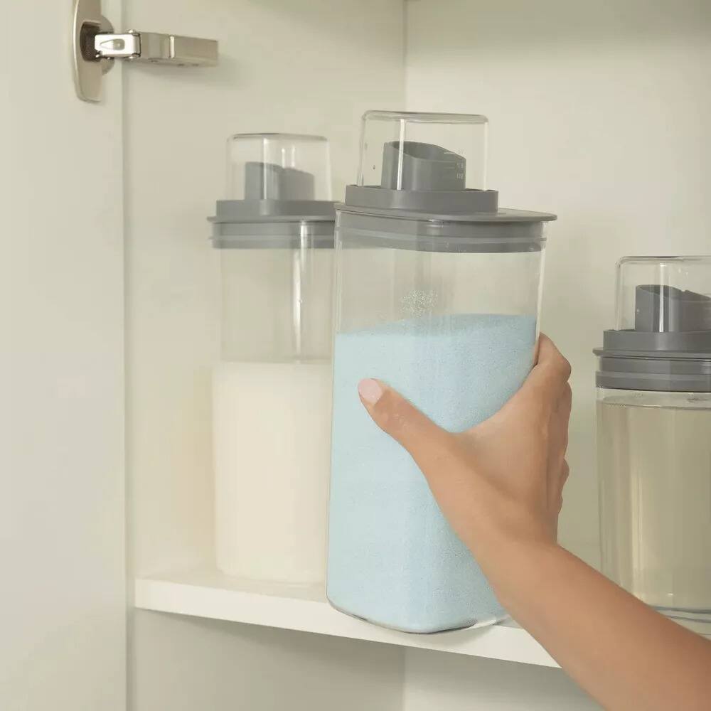 Left. OU - 50 oz Clear Airtight Dispenser with Measuring Cap, Lightweight Soap & Fabric Softener Organizer - Dark Gray.