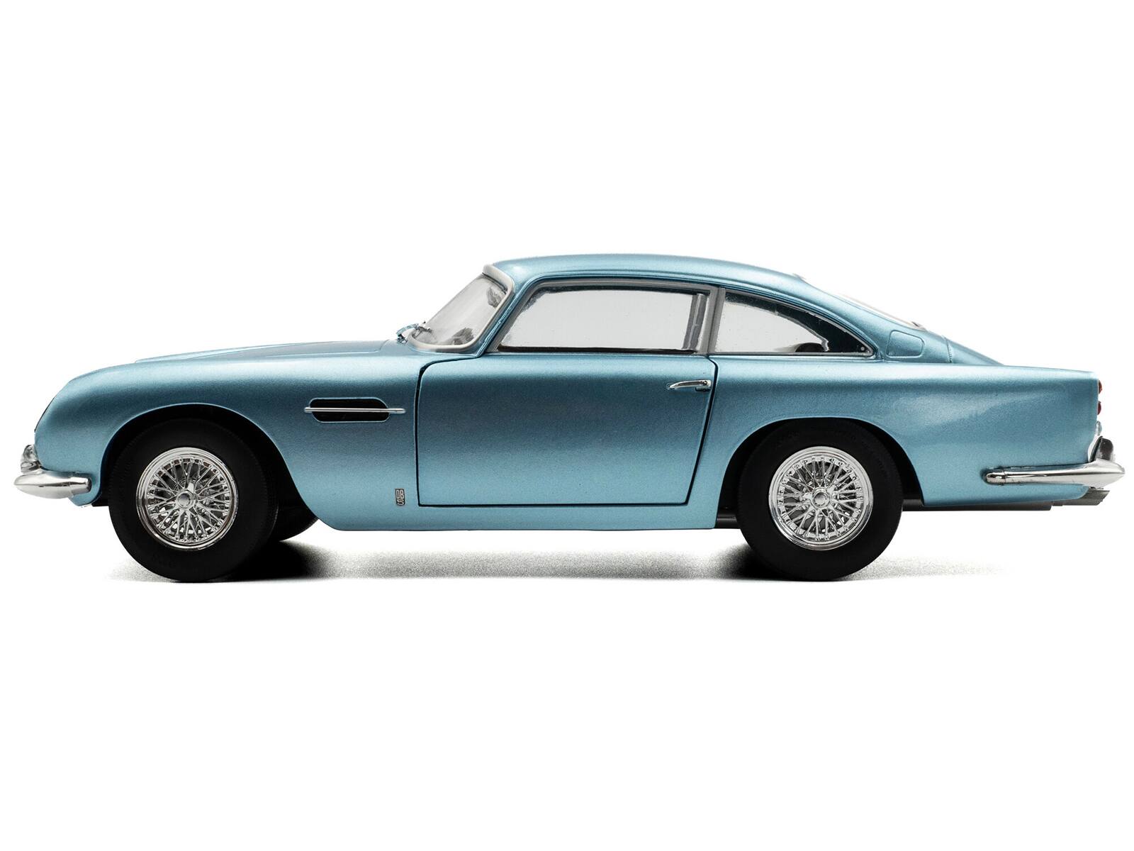 Left. Solido - 1964 Aston Martin DB5 RHD (Right Hand Drive) Light Blue Metallic 1/18 Diecast Model Car by Solido - Light Blue Metallic.