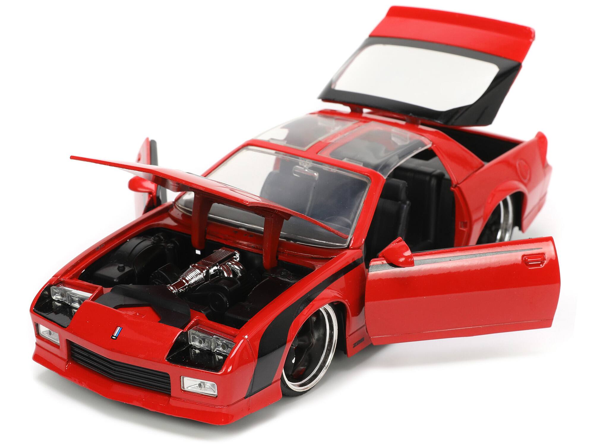 Angle. Jada - 1985 Chevrolet Camaro Red with Black Stripes "Bigtime Muscle" Series 1/24 Diecast Model Car by Jada - Red And Black.