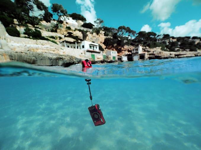 Angle. OM System - Floating Hand Strap for TOUGH Cameras, Buoyant Wrist Strap for Underwater and Water Sports Use - Red.
