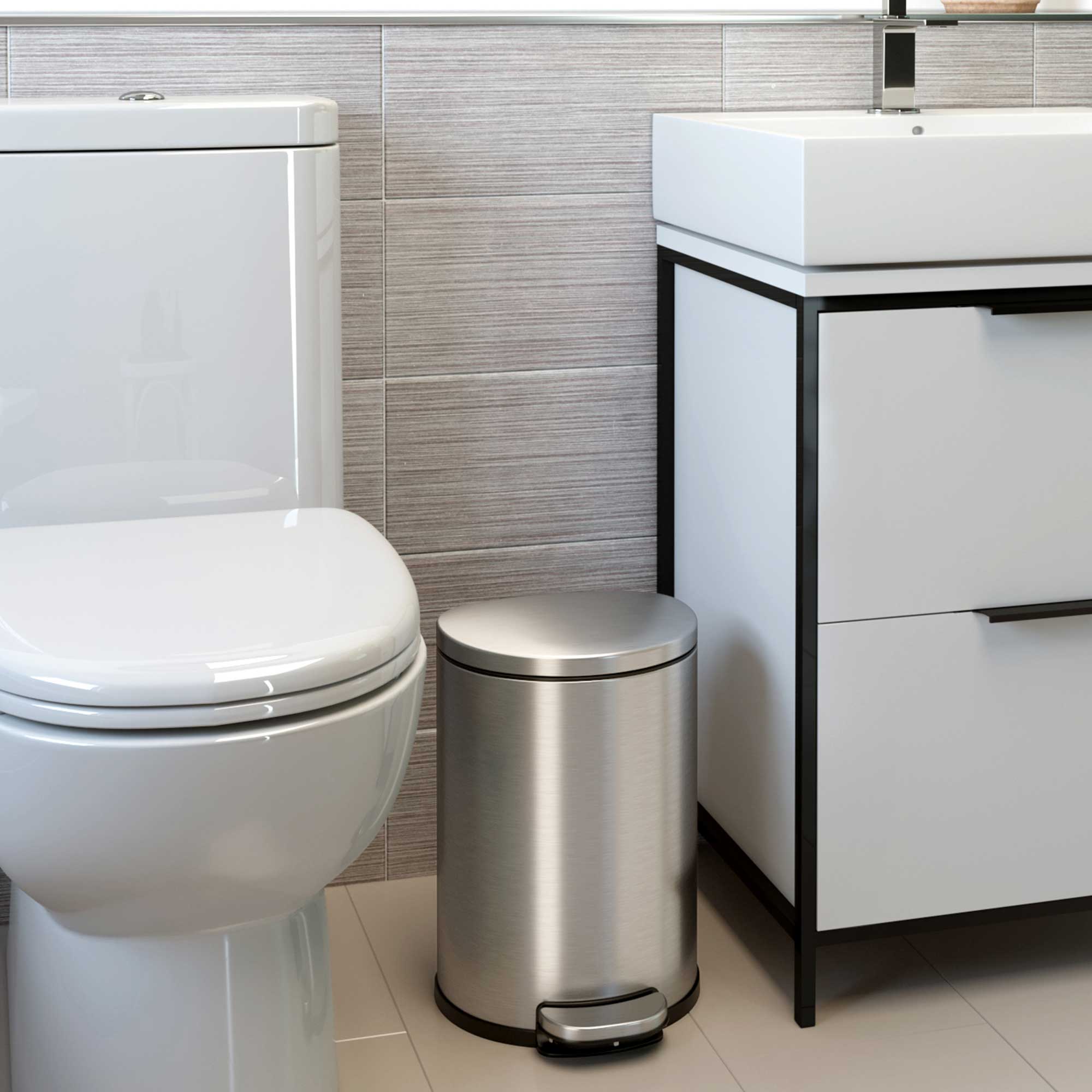 Angle. iTouchless - 2 Gallon SoftStep Semi-Round Stainless Steel Step Bathroom Trash Can with AbsorbX Odor Filter - Silver.