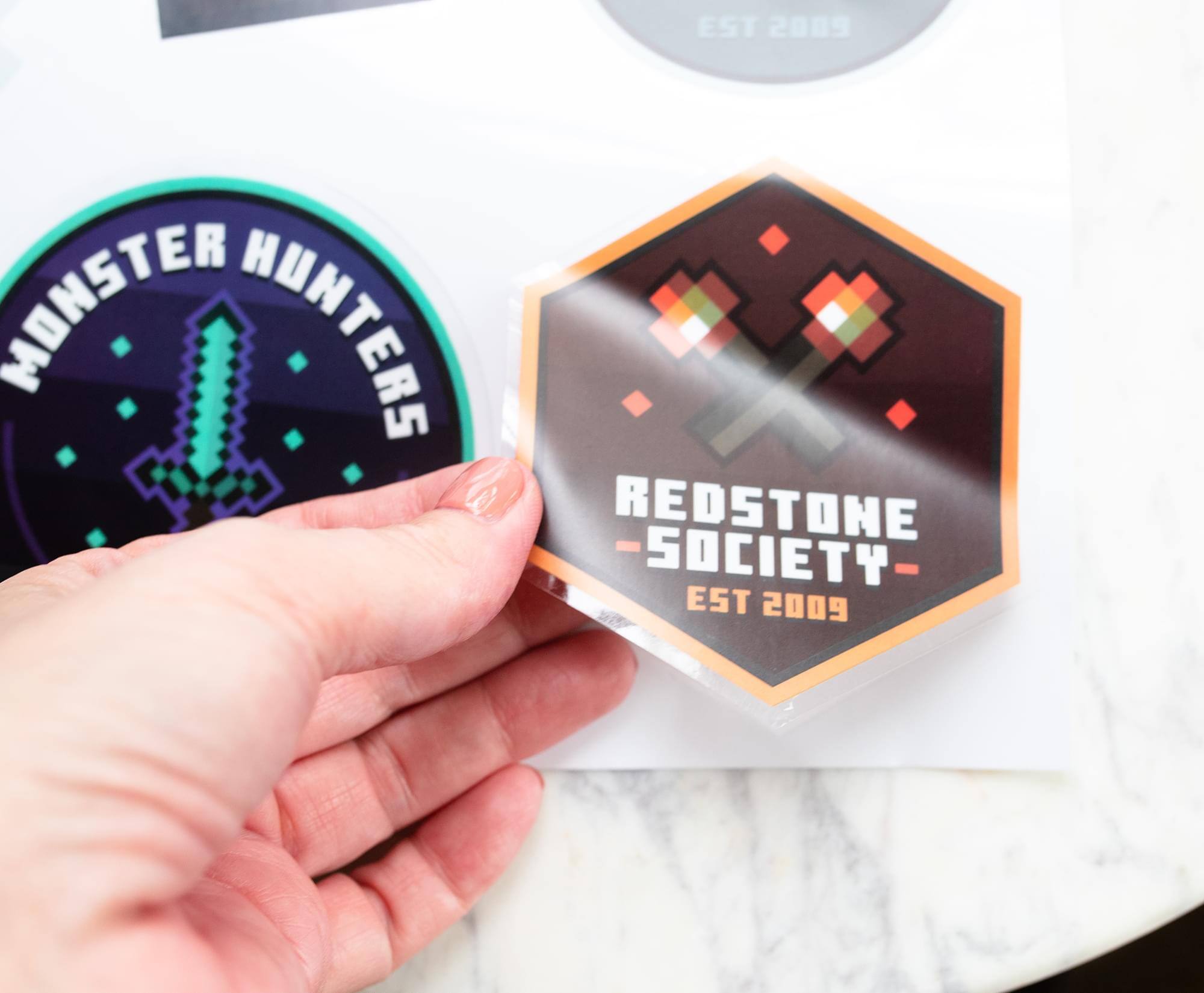 EST 2009  
MONSTER HUNTERS  
REDSTONE SOCIETY  
EST 2009