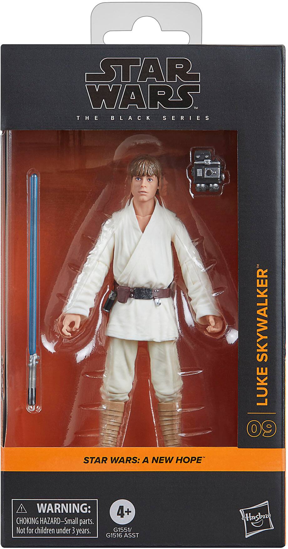 The image features a Star Wars action figure of Luke Skywalker from "A New Hope." The figure is part of the Black Series and is packaged in a plastic case. The packaging warns that the toy contains small parts and is not suitable for children under the age of three. The figure is a collectible item for fans of the Star Wars franchise.