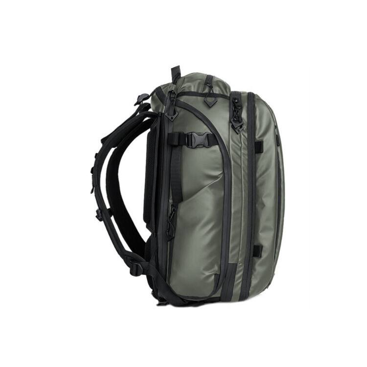 Left. WANDRD - WANDRD Transit Travel Backpack with Quick-Draw Side Access (Wasatch Green, 45L) - Green.