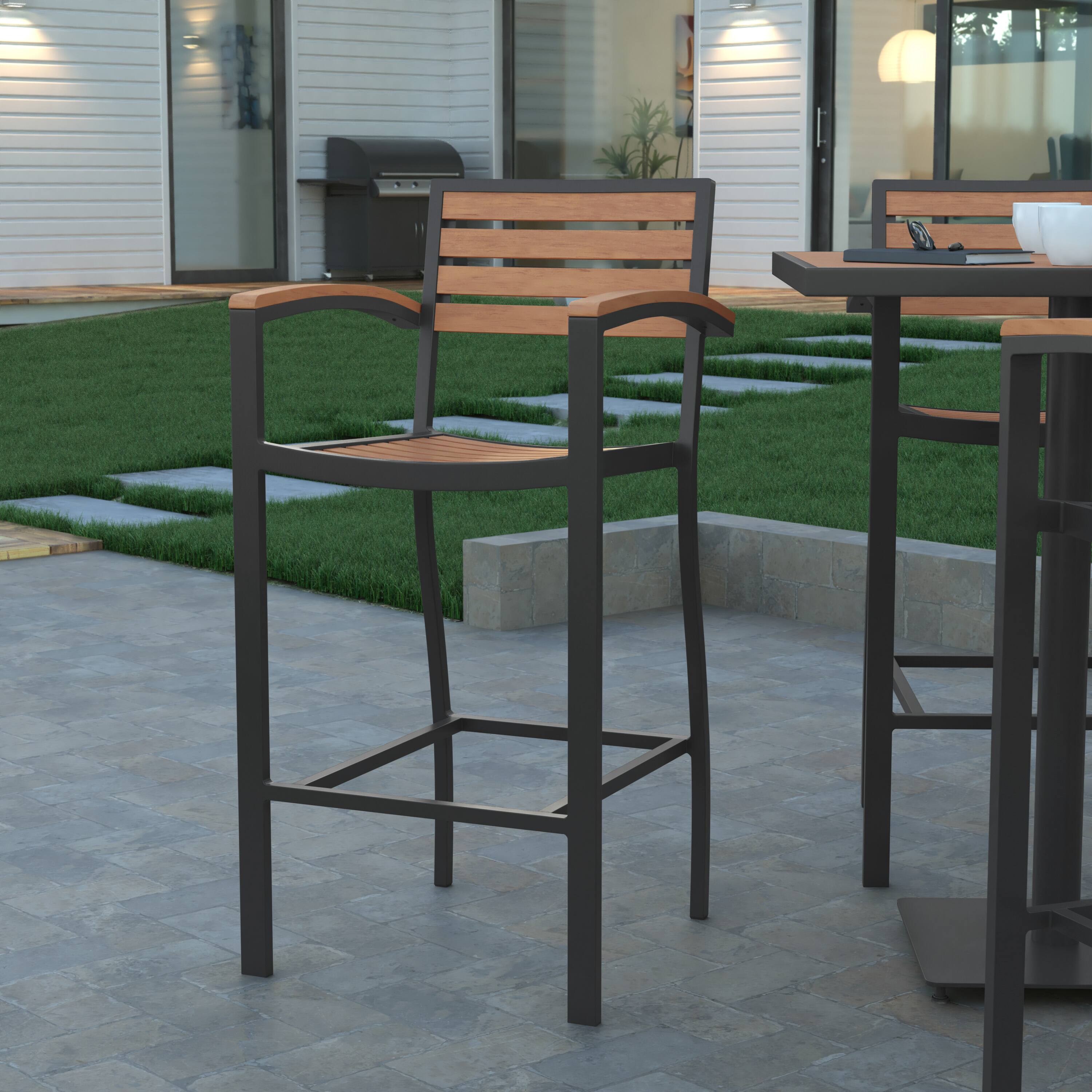 Alt View 1. Emma + Oliver - Livia All-Weather Bar Height Dining Stool with Armrests, Polyresin Slats and Aluminum Frame - Teak.