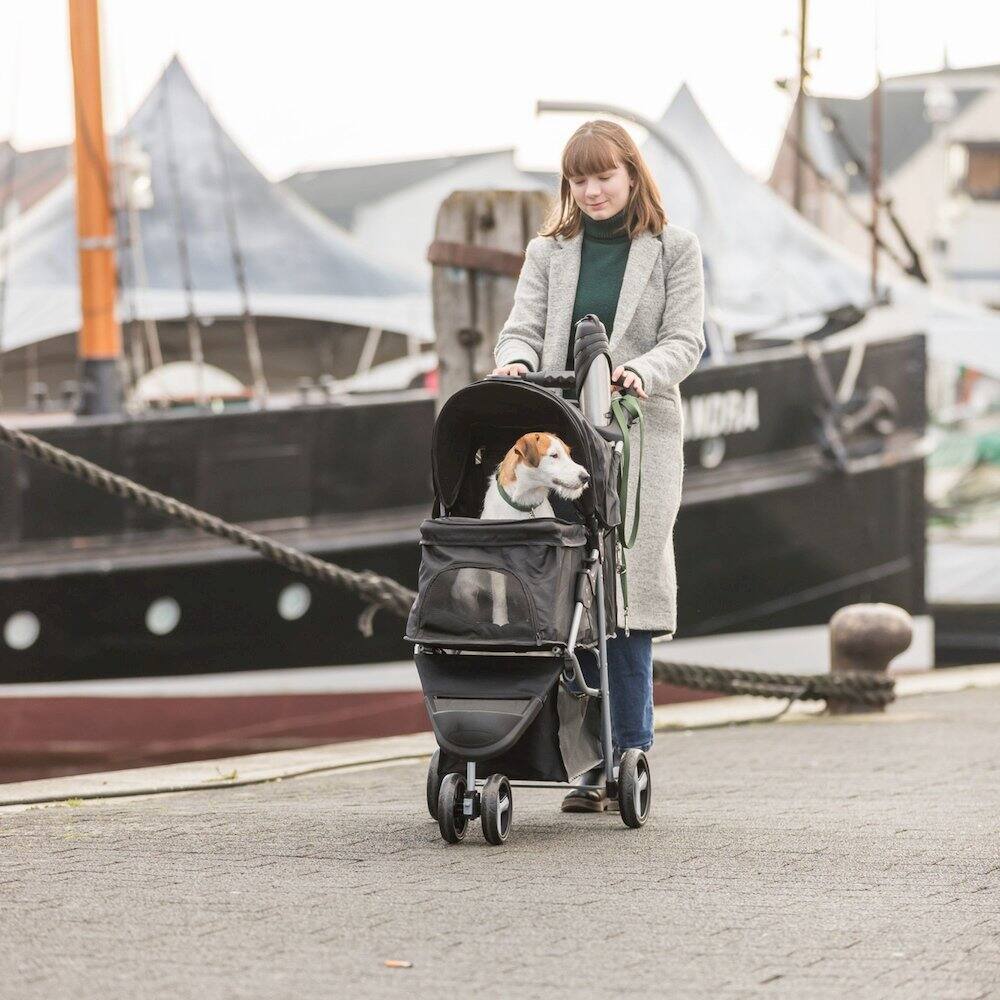 Left. TRIXIE - 3-Wheeled Foldable Dog & Cat Stroller with Canopy and Storage Compartments - Black.