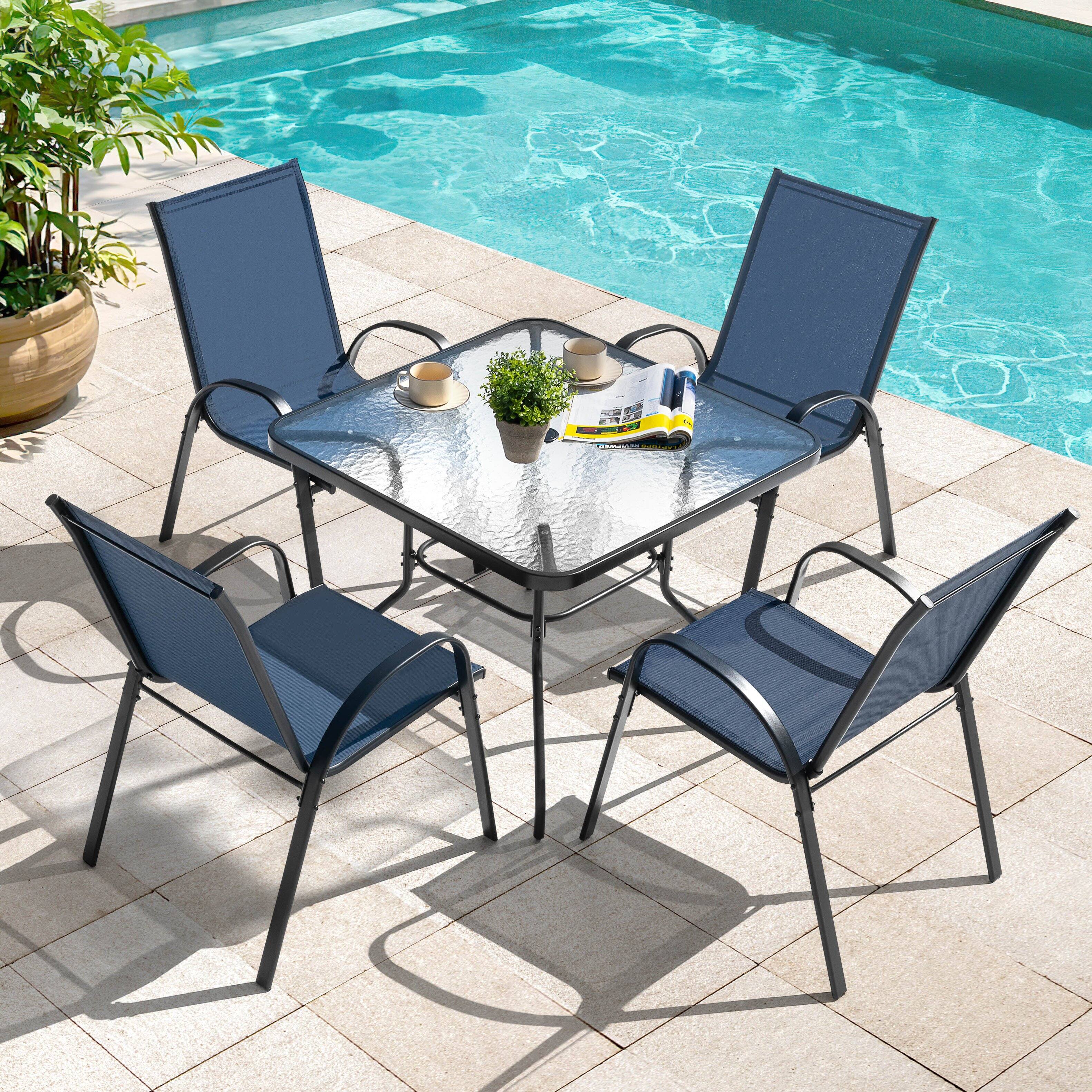 Left. Nuu Garden - 5-Piece Metal and Textilene Outdoor Dining Set, 4 Stackable Chairs and Tempered Glass Table with Umbrella Hole - Blue and Transparent.