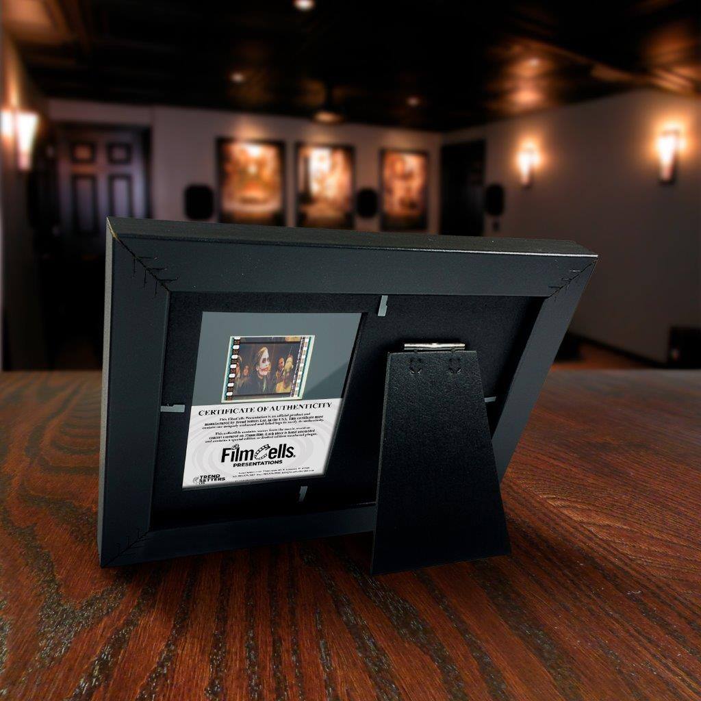CERTIFICATE OF AUTHENTICITY

FilmCells PRESENTATIONS

This certificate is issued to verify that the film cells contained within this frame are authentic and have been removed from a genuine film print. The film cells are from the movie "The Dark Knight" and are a part of the original film print used in the production of the film. The film cells are a unique and collectible item, and this certificate serves as proof of their authenticity.

This certificate is issued by FilmCells, a division of The Film Cell Company, LLC. The film cells are protected by a clear, archival-quality acrylic cover and are mounted on a black, acid-free backing board. The frame is made of high-quality materials and is designed to preserve the film cells for generations to come.

This certificate is not transferable and is for the use of the original purchaser only. The film cells are not to be removed from the frame or altered in any way. The film cells are protected by copyright law and are not to be reproduced or used for any commercial purpose without the permission of The Film Cell Company, LLC.

This certificate is issued on [Date] and is valid for the lifetime of the film cells.

[Signature]

[Date]

[Seal]

[Logo]

[Website]