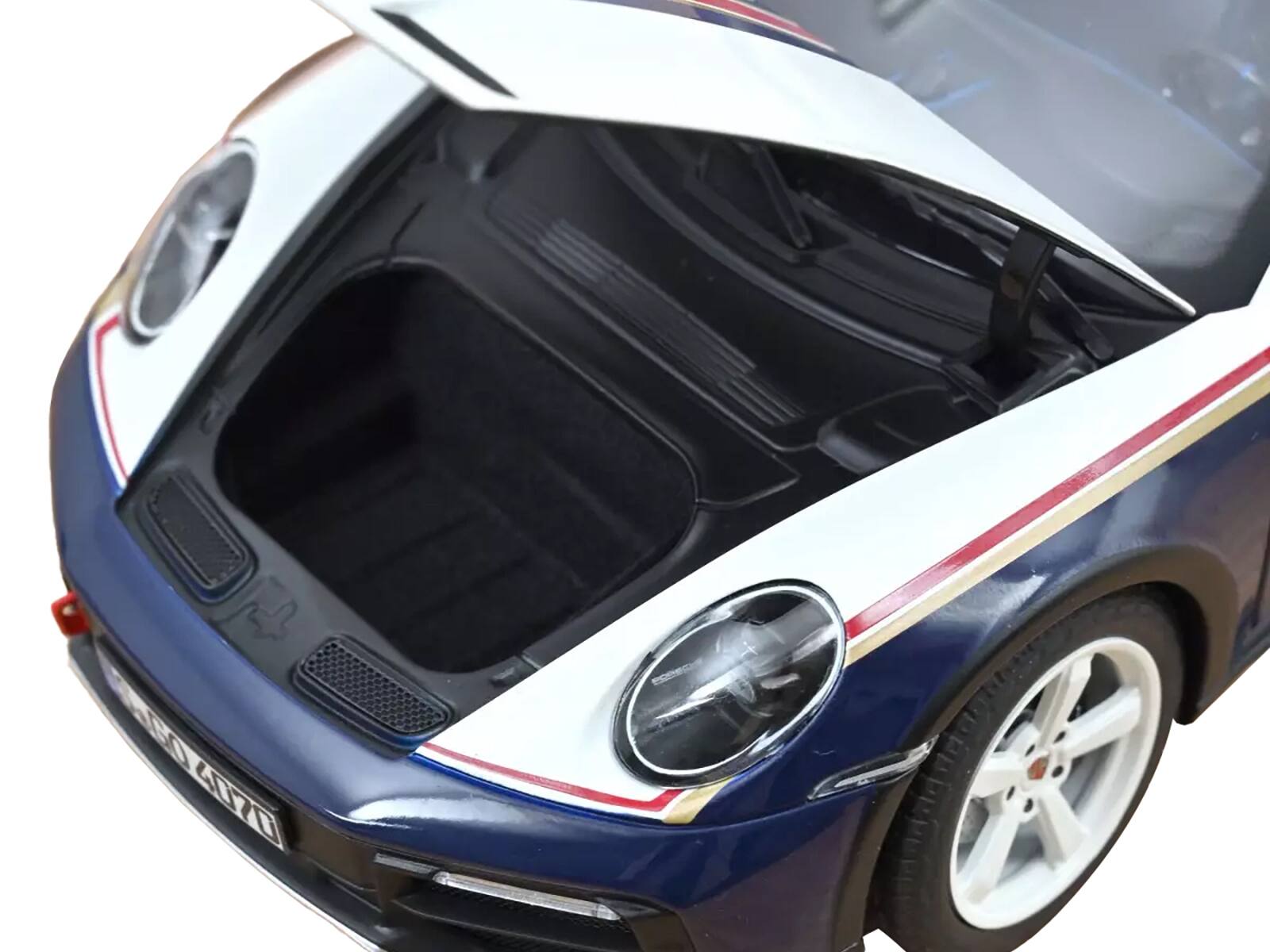 Left. Norev - 2023 Porsche 911 Dakar #953 "Roughroads Porsche" Blue and White with Stripes 1/18 Diecast Model Car by Norev - Blue and White.